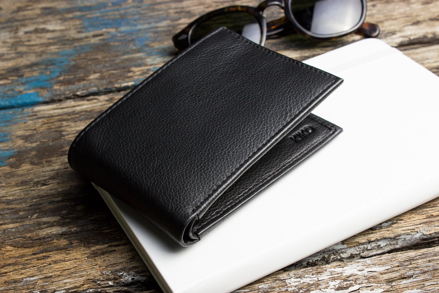 Traditional Bifold Wallet made of glove tanned cowhide leather with removable ID window and multiple card slots.