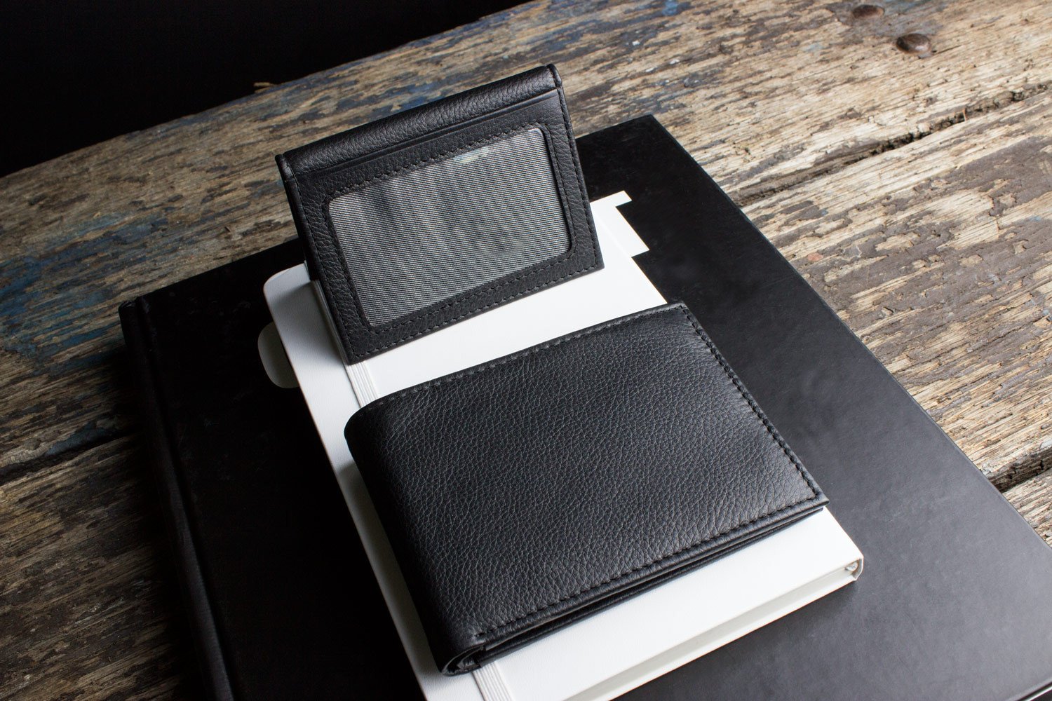 Traditional Bifold Wallet made of glove tanned cowhide leather with removable ID window and multiple card slots.