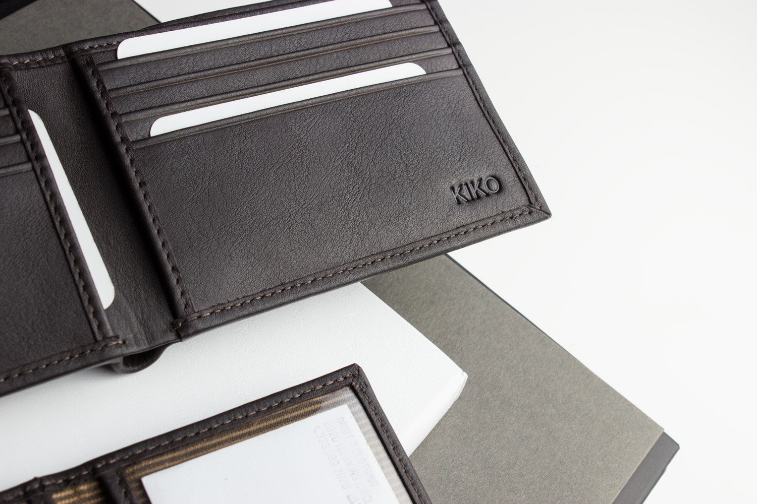 Traditional Bifold Wallet made of glove tanned cowhide leather with removable ID window and multiple card slots.