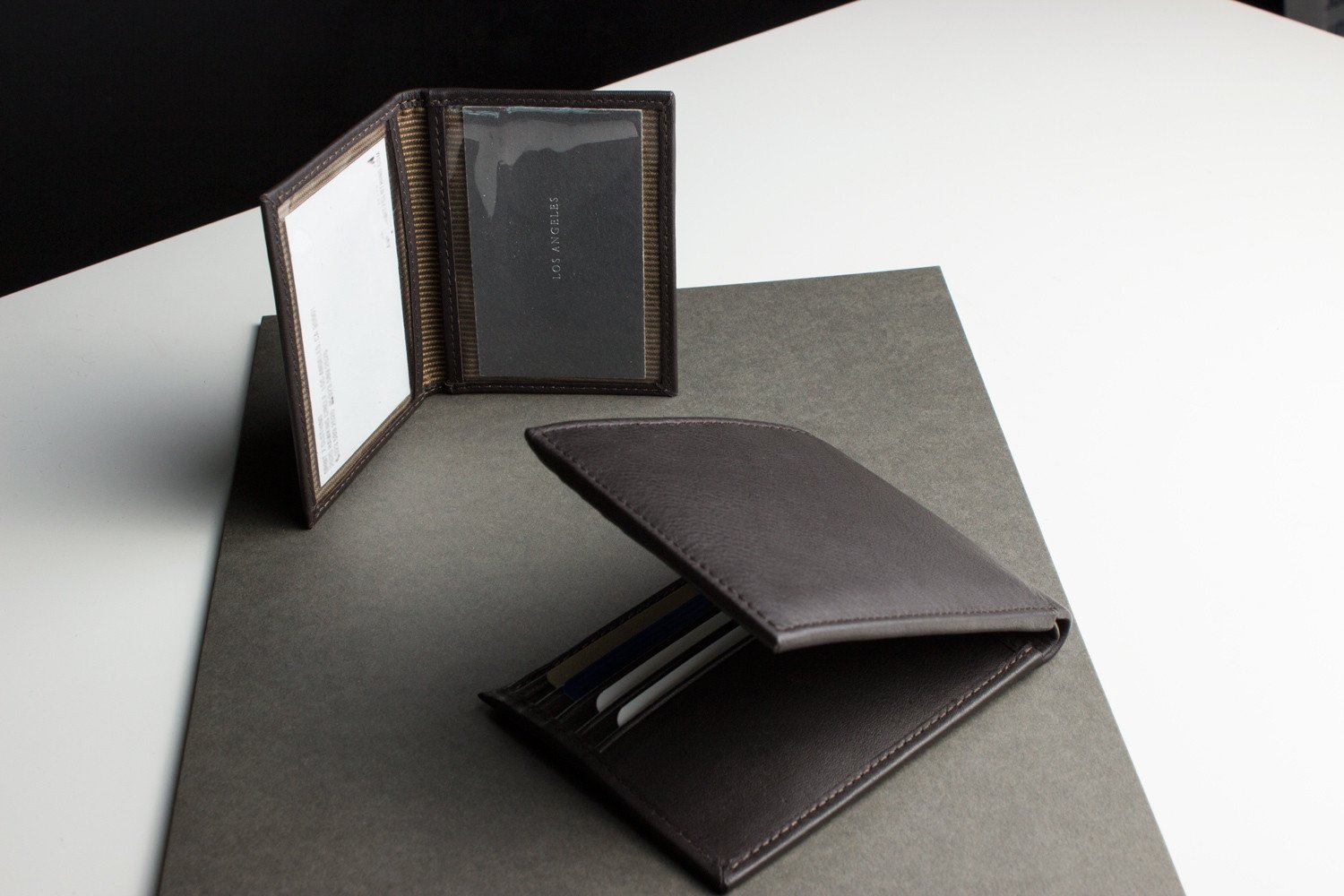 Traditional Bifold Wallet made of glove tanned cowhide leather with removable ID window and multiple card slots.