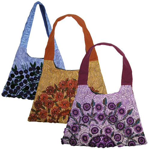 Trapezoid Rococo Handbag made from recycled Huipils, showcasing vibrant colors and unique design, perfect for stylish everyday use.