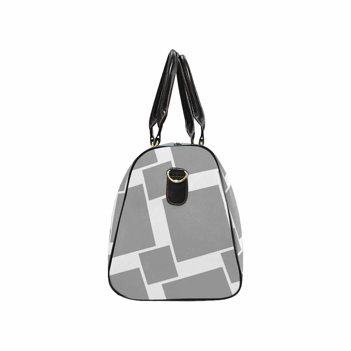 Grey travel bag with adjustable shoulder strap, spacious main compartment, and durable design.