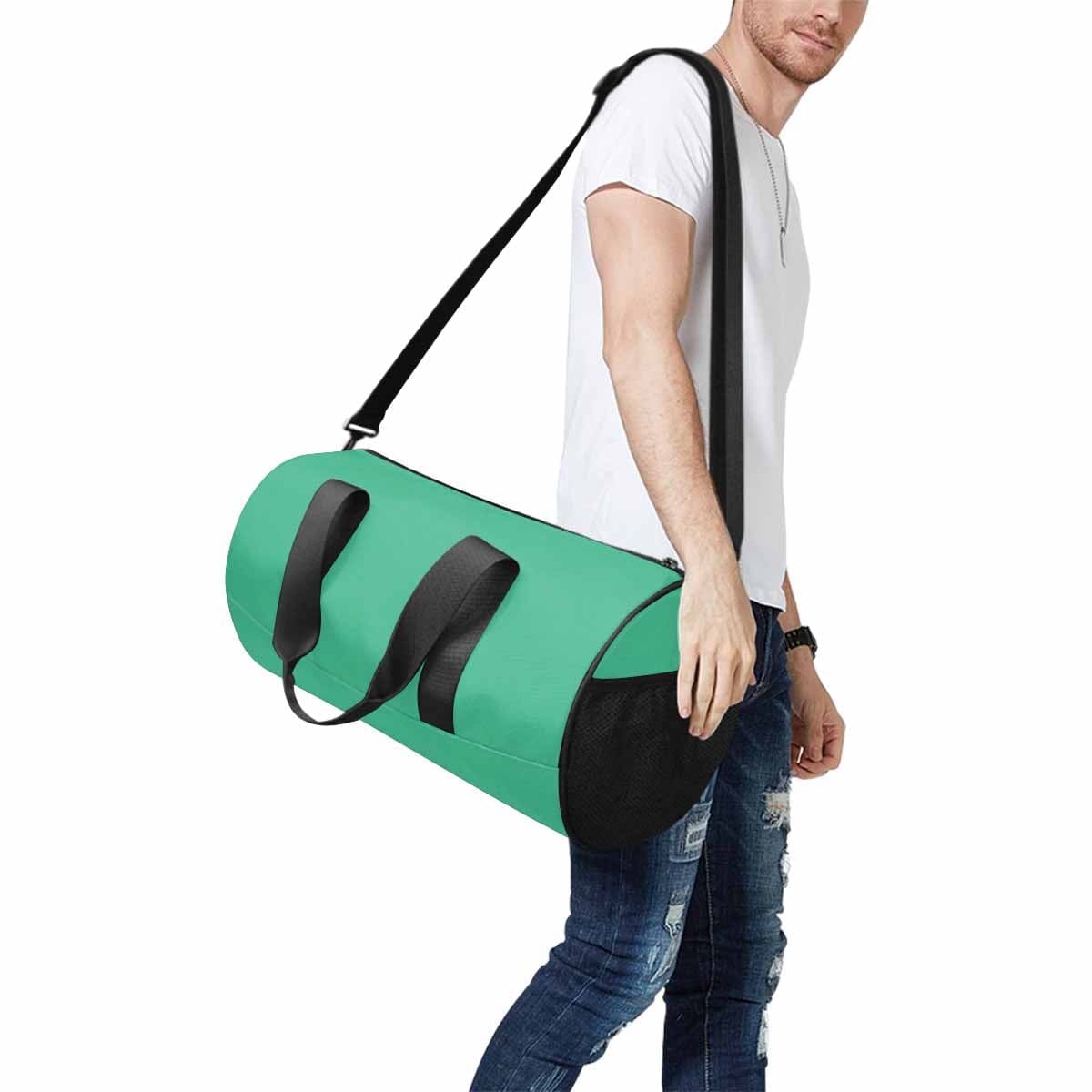 Mint Green Travel Duffel Bag with waterproof fabric and spacious design, ideal for travel and outdoor activities.