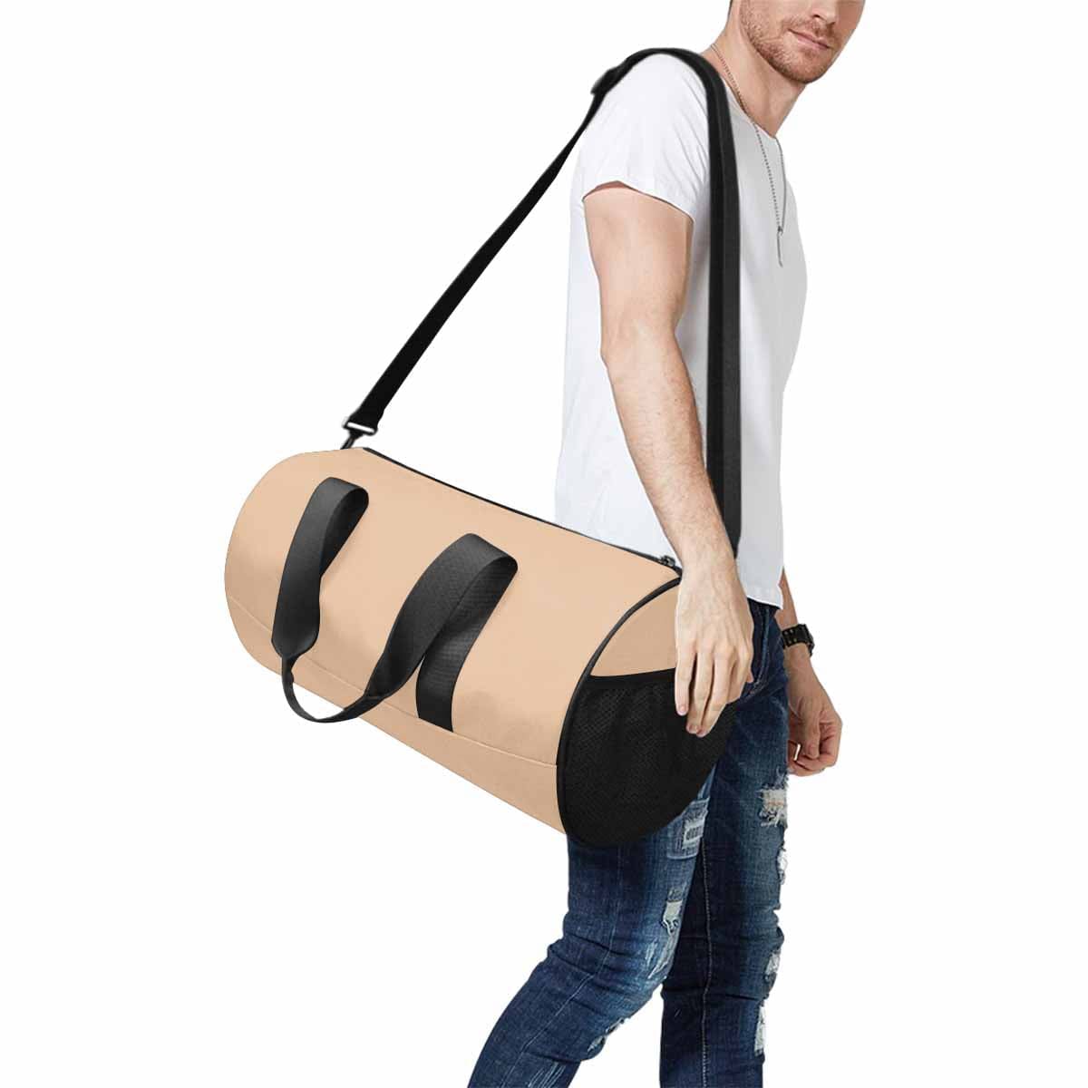 Pale brown travel duffel bag made from waterproof fabric, featuring a spacious main compartment and adjustable shoulder strap.