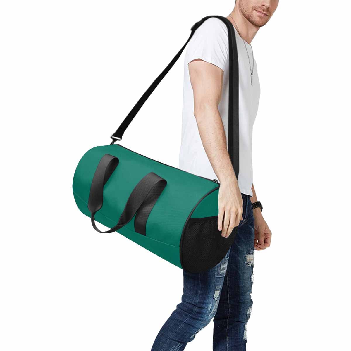 Teal Green Travel Duffel Bag with waterproof fabric and spacious compartments, perfect for travel and outdoor activities.