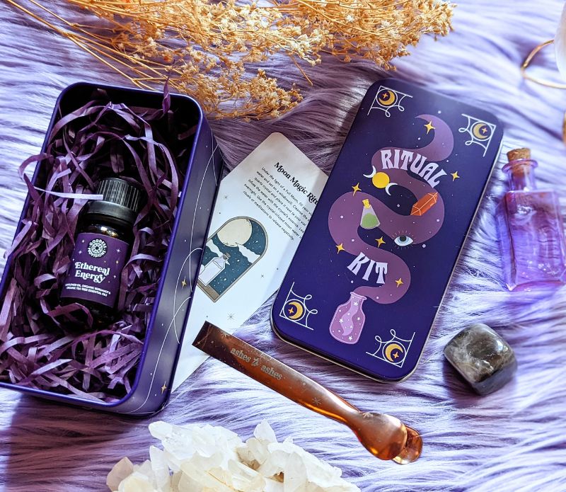 Travel Ritual Kit by Goddess Provisions featuring essential oil, crystal, brass tongs, and glass vial for spiritual practices.