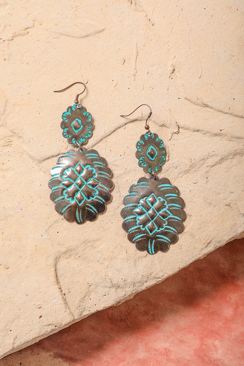 A pair of elegant turquoise flower drop earrings made from brass, showcasing a floral design with vibrant turquoise accents.