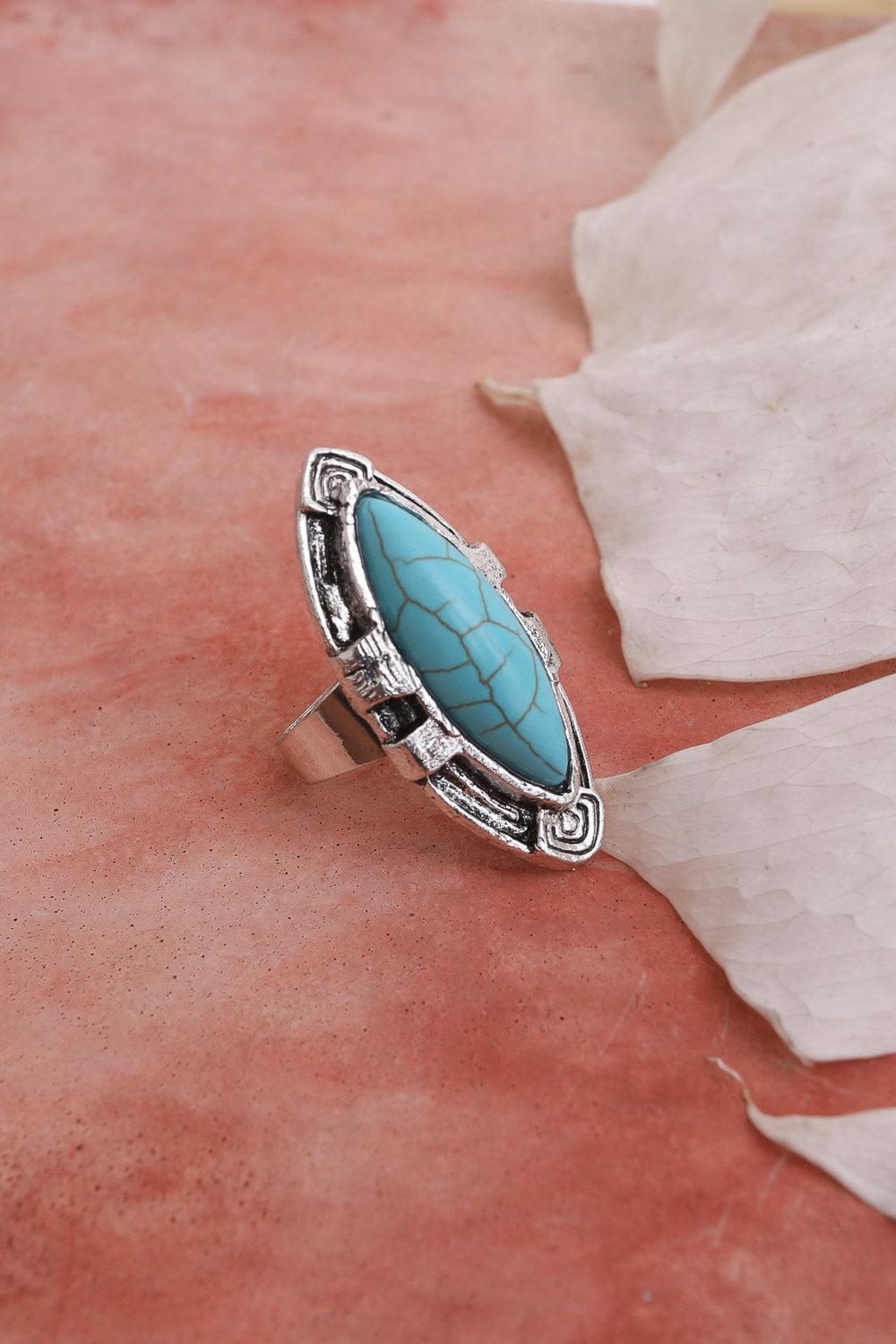 Turquoise marquise cut silver ring featuring an adjustable design and vibrant turquoise stone set in sterling silver.