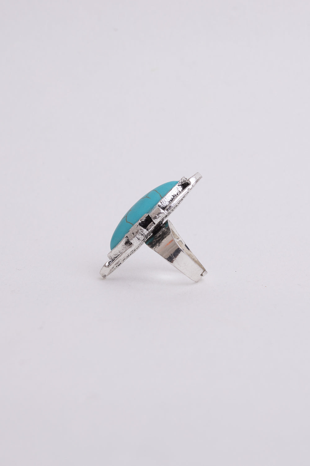 Turquoise marquise cut silver ring featuring an adjustable design and vibrant turquoise stone set in sterling silver.