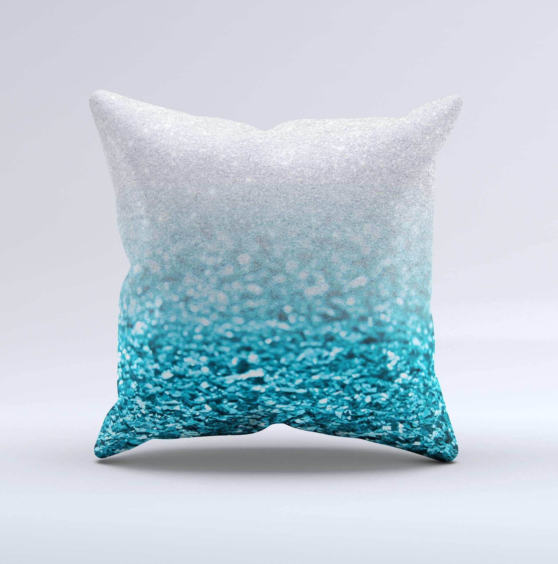 Turquoise and silver decorative throw pillow with a glimmer fade design, handcrafted in Virginia, showcasing unique imperfections.