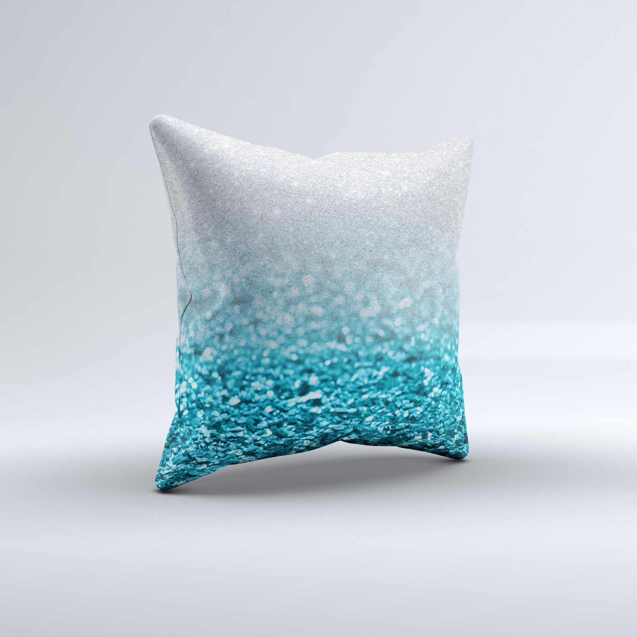 Turquoise and silver decorative throw pillow with a glimmer fade design, handcrafted in Virginia, showcasing unique imperfections.