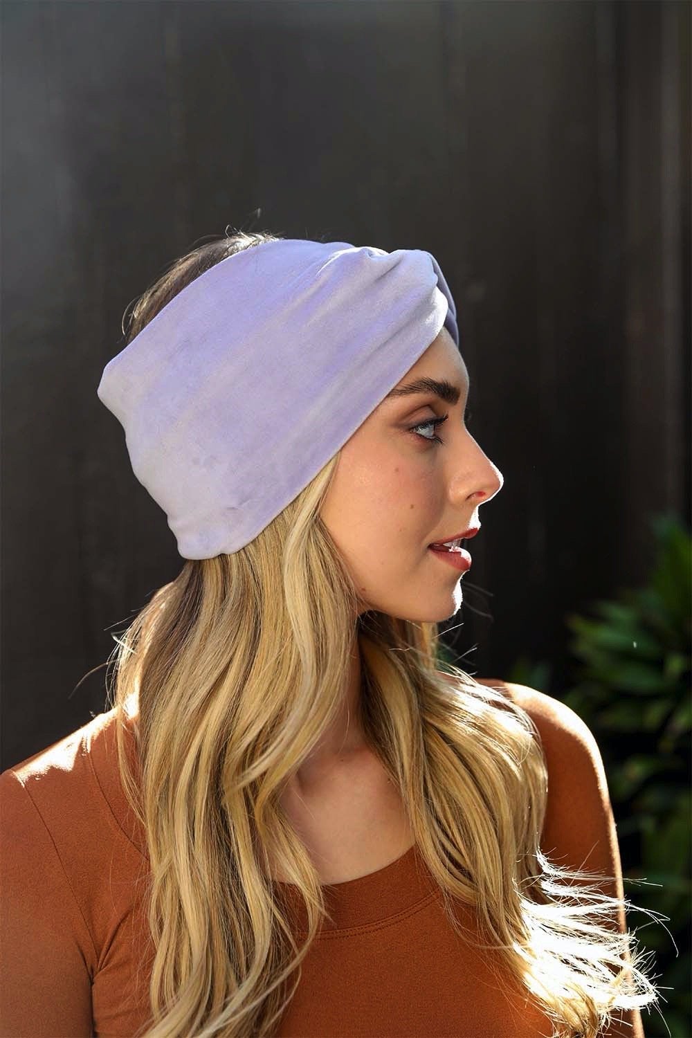 A collection of Twisted Velvet Headbands in various colors, showcasing their soft texture and elegant twisted design.