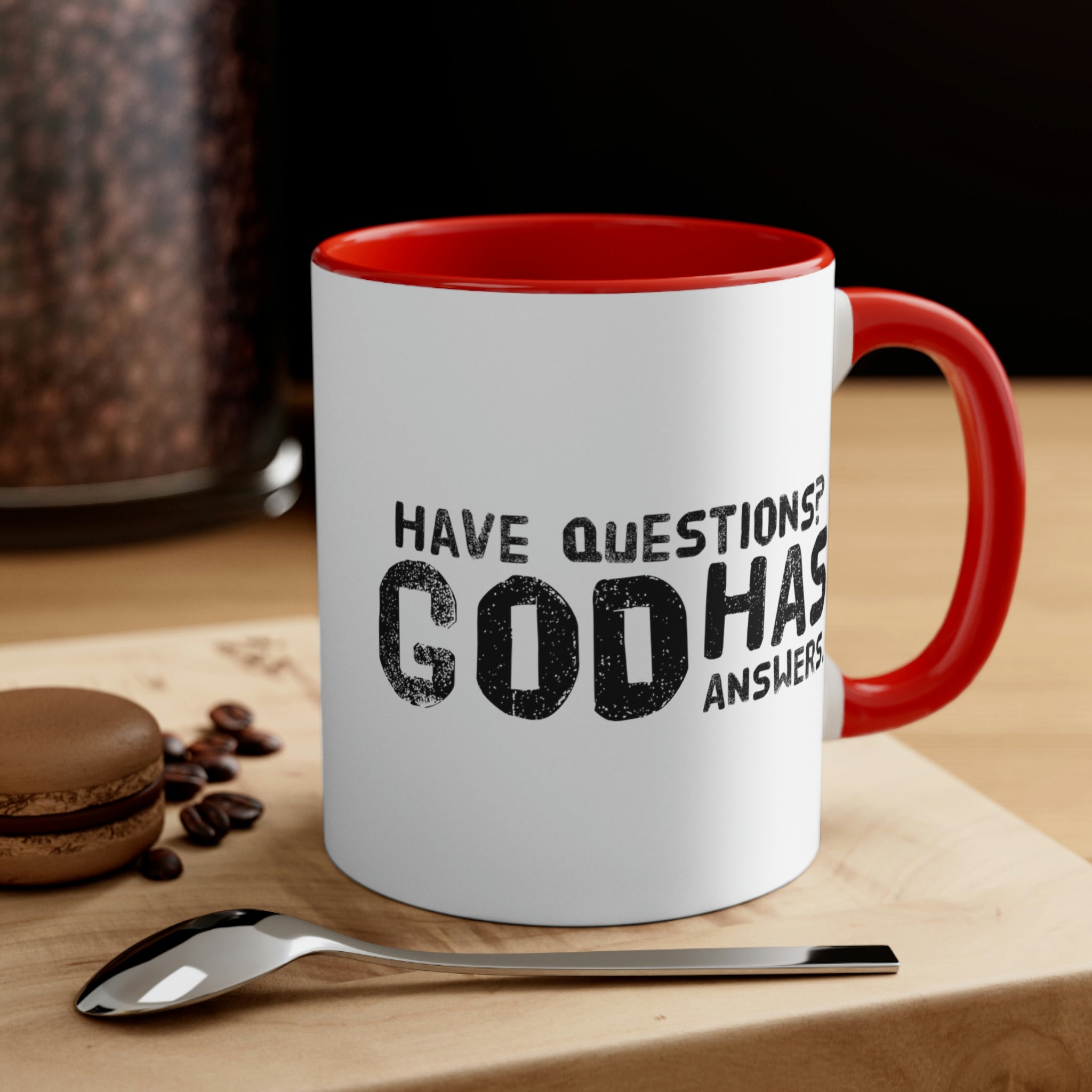 Two-tone ceramic mug with a colorful interior and handle, featuring the print 'Have Questions? God has Answers'.