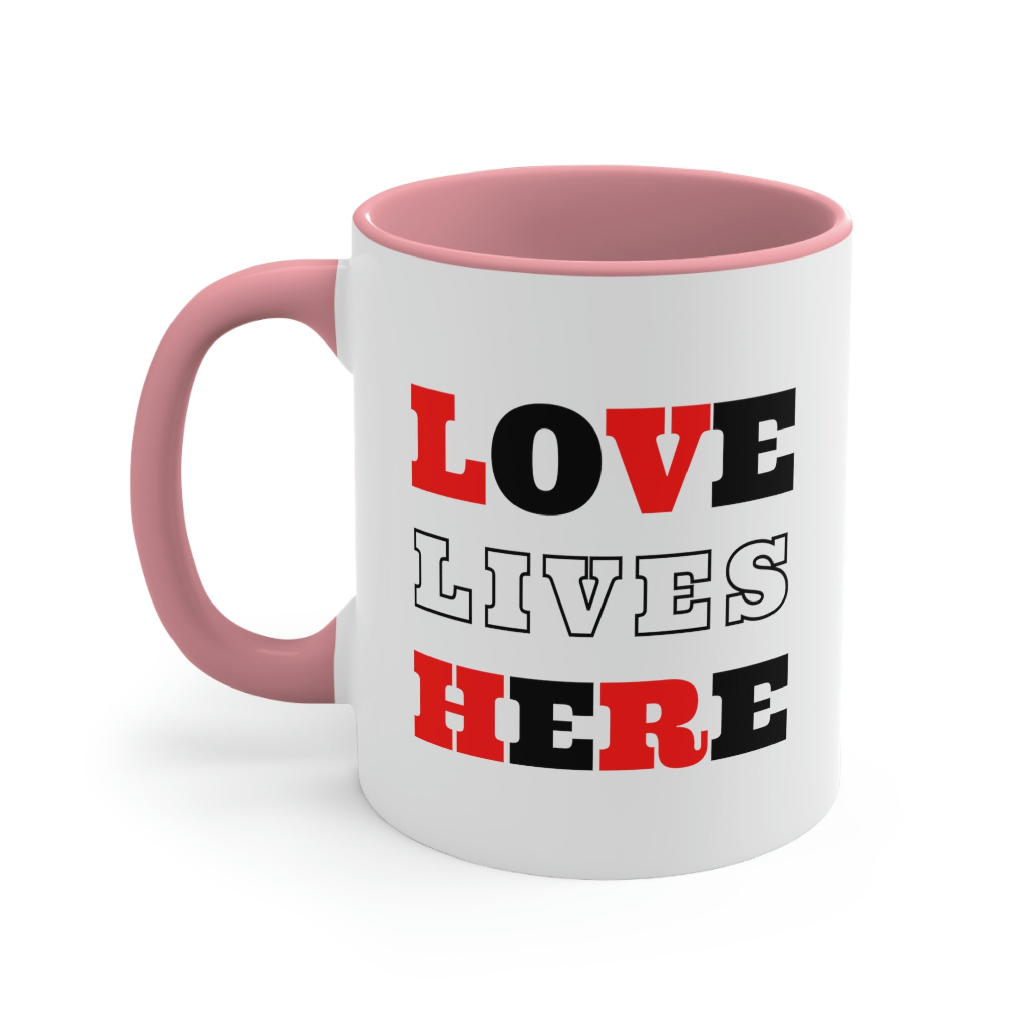 Two-tone ceramic mug with a white exterior and colored interior, featuring a comfortable C-handle and the phrase 'Love Lives Here'.