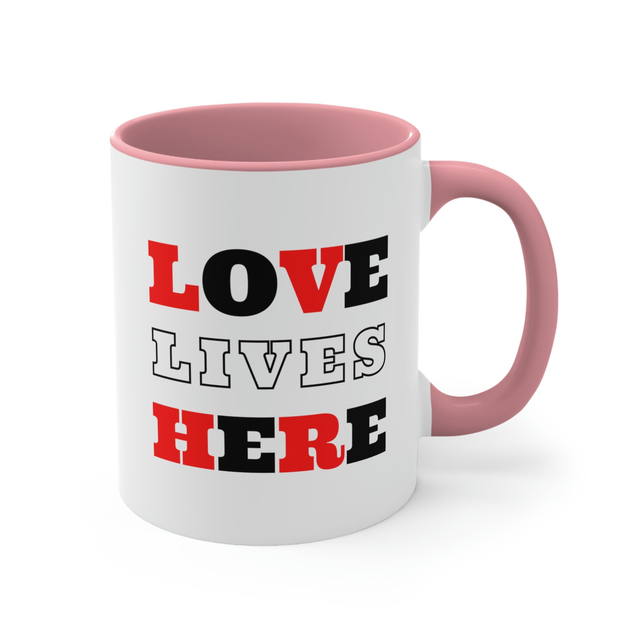 Two-tone ceramic mug with a white exterior and colored interior, featuring a comfortable C-handle and the phrase 'Love Lives Here'.