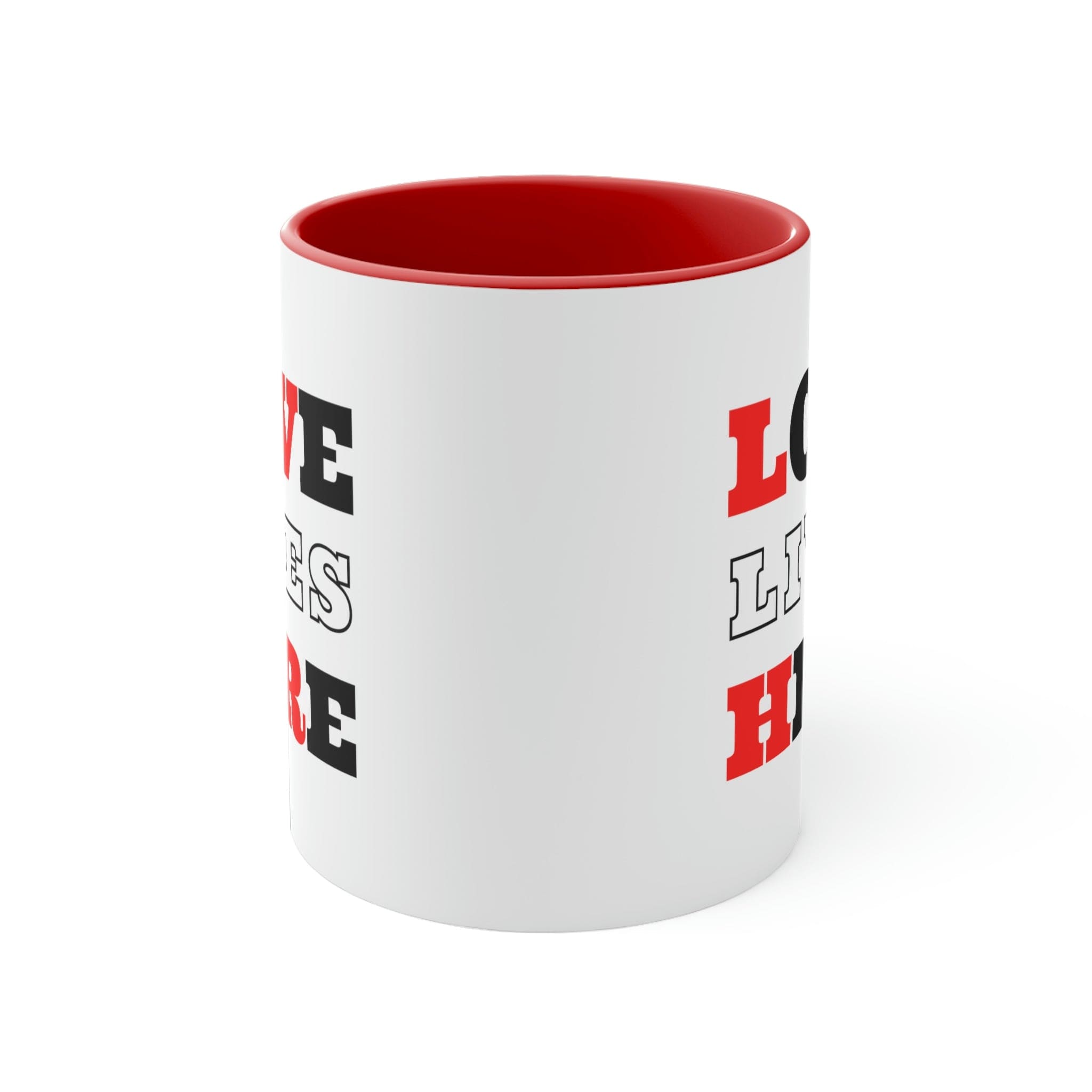 Two-tone ceramic mug with a white exterior and colored interior, featuring a comfortable C-handle and the phrase 'Love Lives Here'.