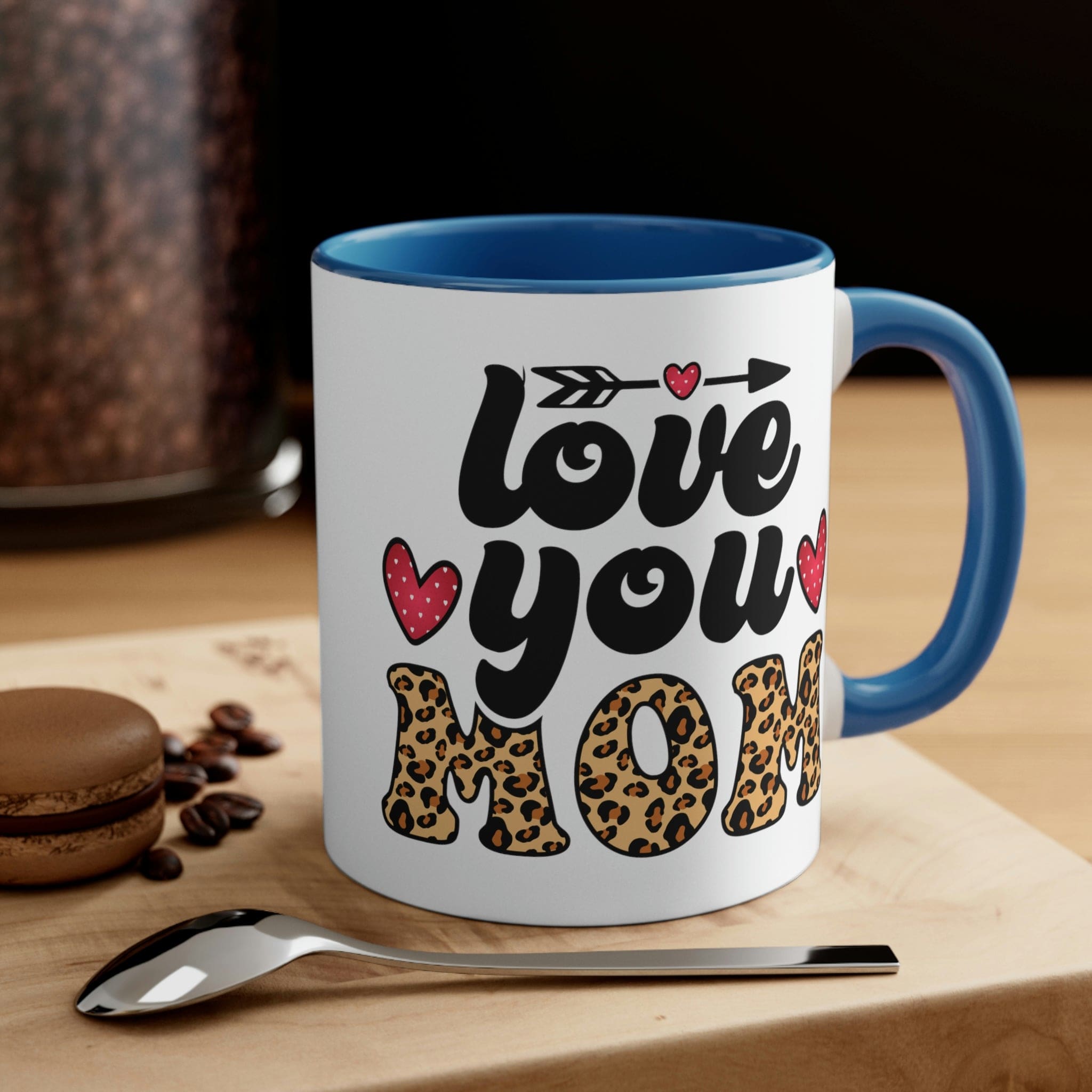 Two-tone ceramic mug with 'Love you Mom' illustration, featuring a colorful interior and comfortable C-handle.