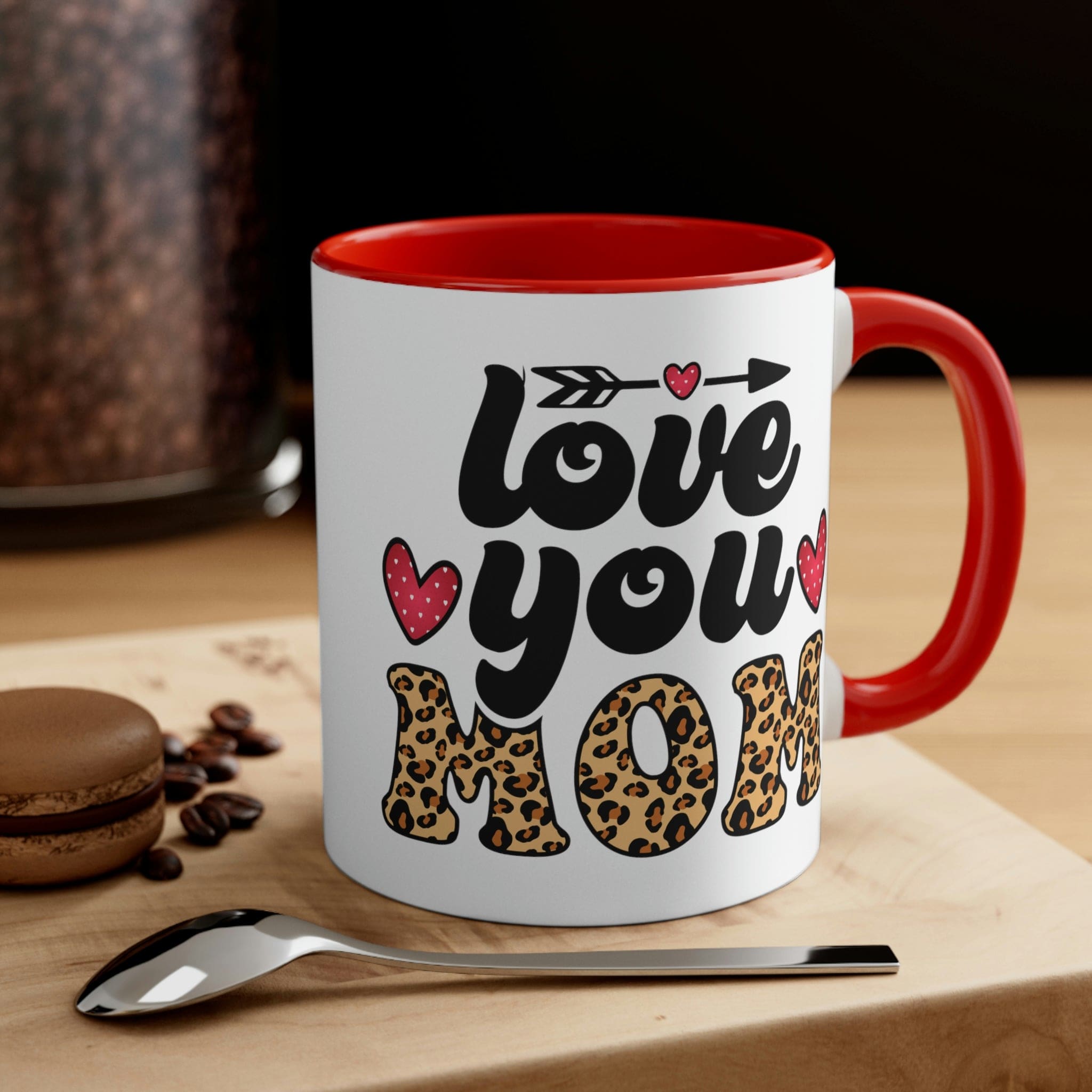 Two-tone ceramic mug with 'Love you Mom' illustration, featuring a colorful interior and comfortable C-handle.