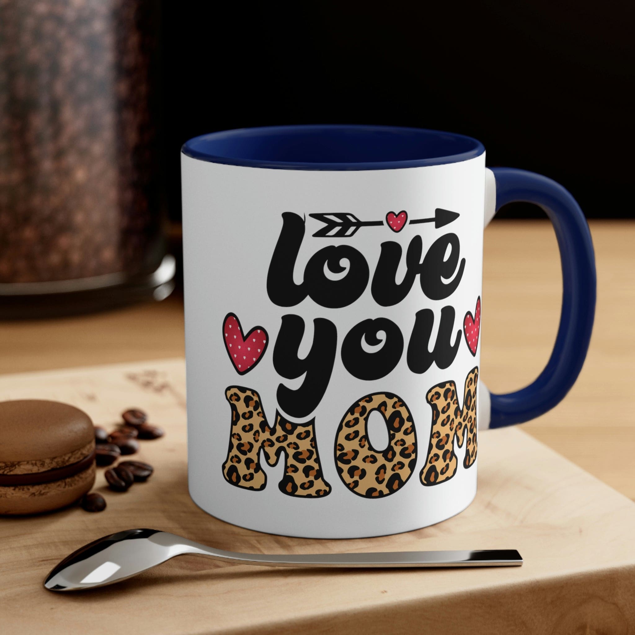 Two-tone ceramic mug with 'Love you Mom' illustration, featuring a colorful interior and comfortable C-handle.