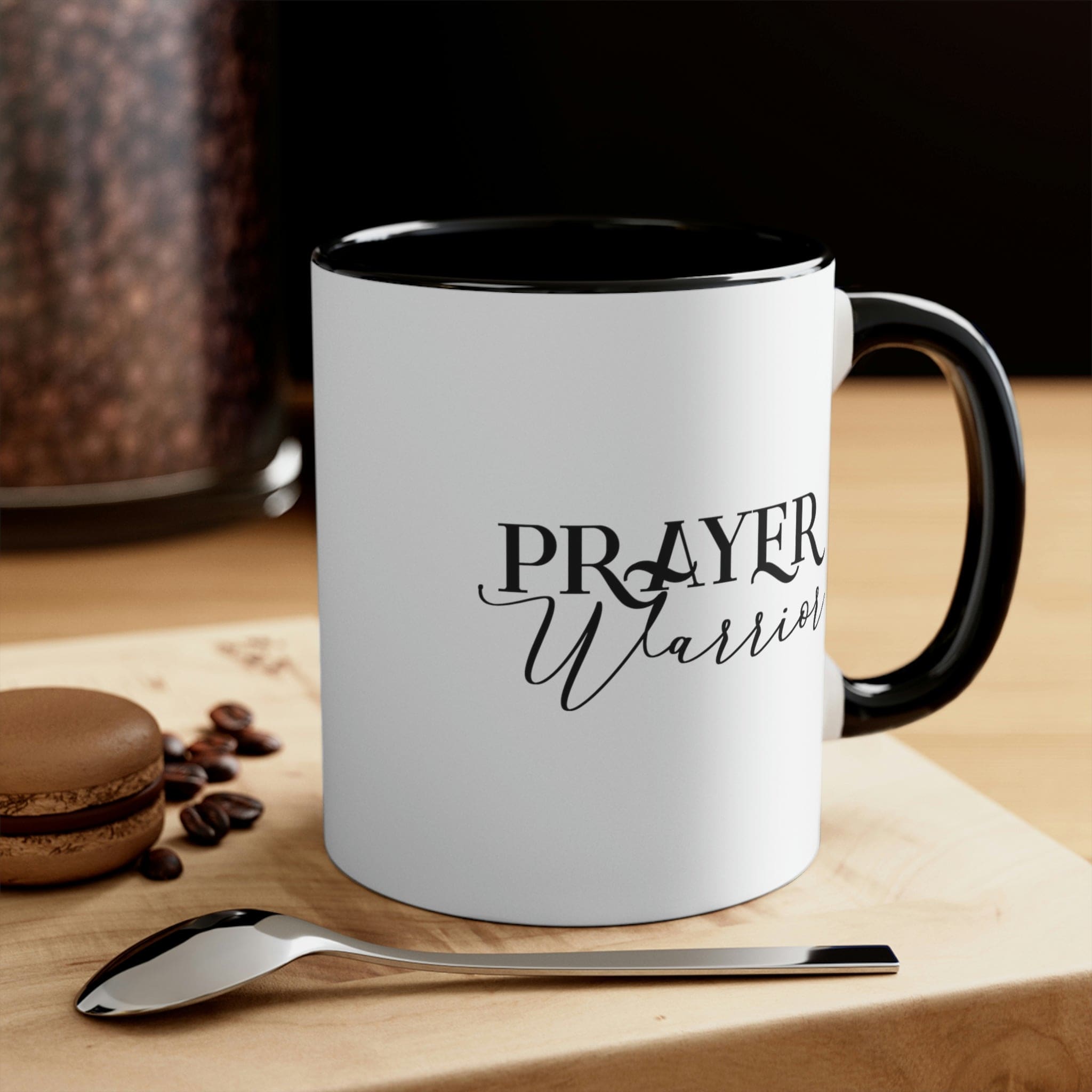 Two-tone ceramic mug with Prayer Warrior illustration and comfortable C-handle, showcasing vibrant colors.