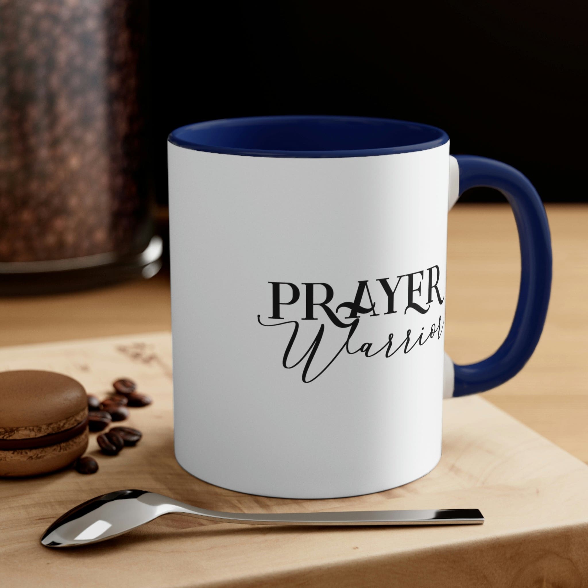 Two-tone ceramic mug with Prayer Warrior illustration and comfortable C-handle, showcasing vibrant colors.