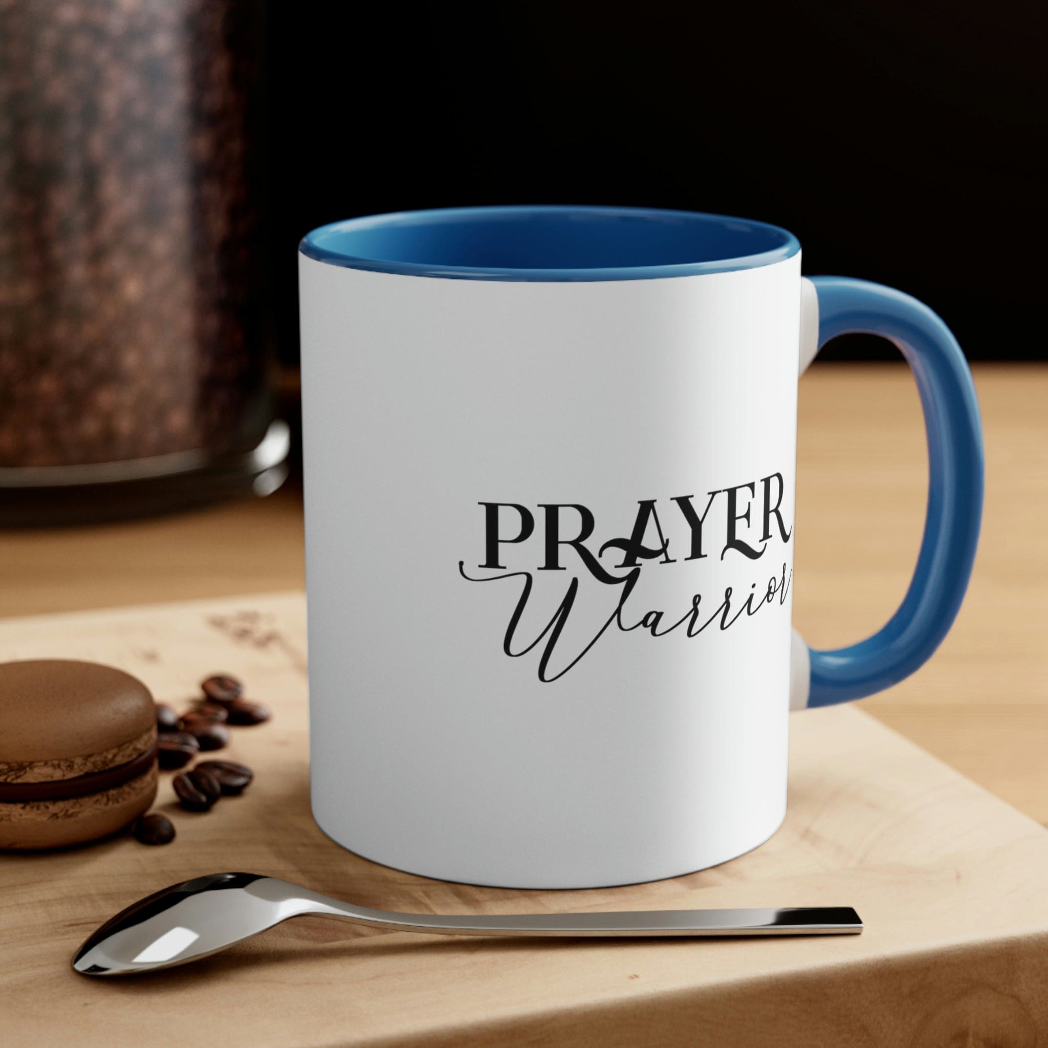 Two-tone ceramic mug with Prayer Warrior illustration and comfortable C-handle, showcasing vibrant colors.