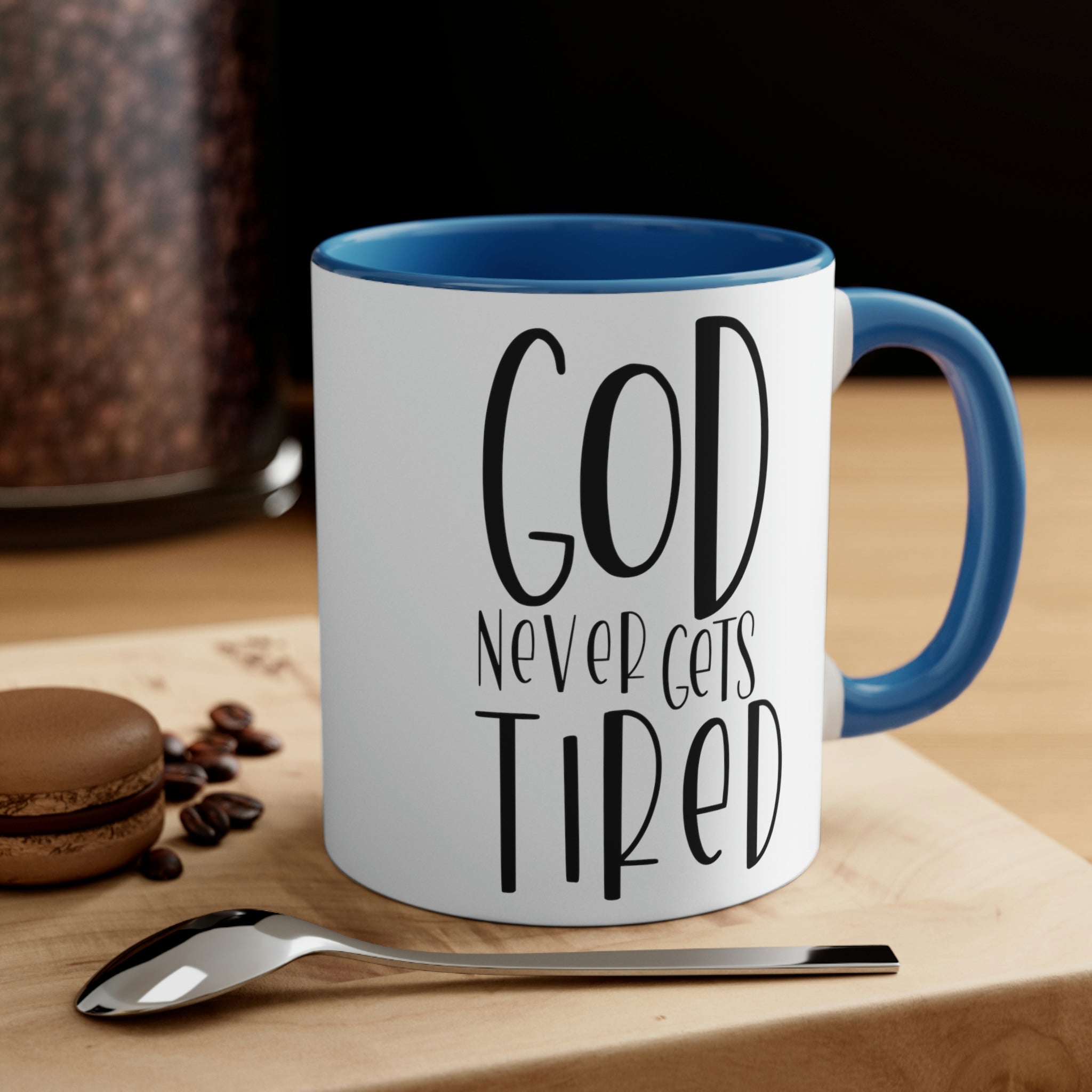 Two-tone ceramic mug with a white exterior and colored interior, featuring a comfortable C-handle and motivational design.