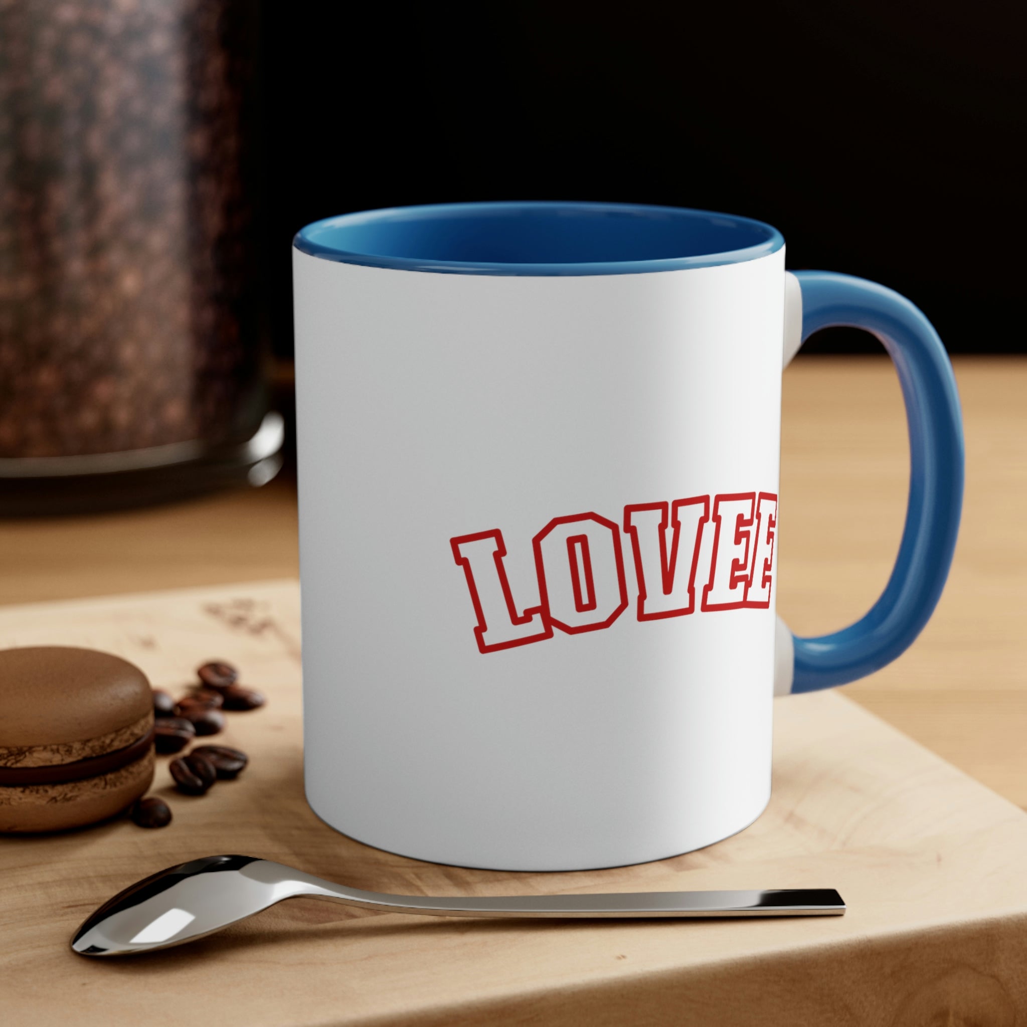 Two-tone ceramic mug with a white exterior and colored interior, featuring a comfortable C-handle.