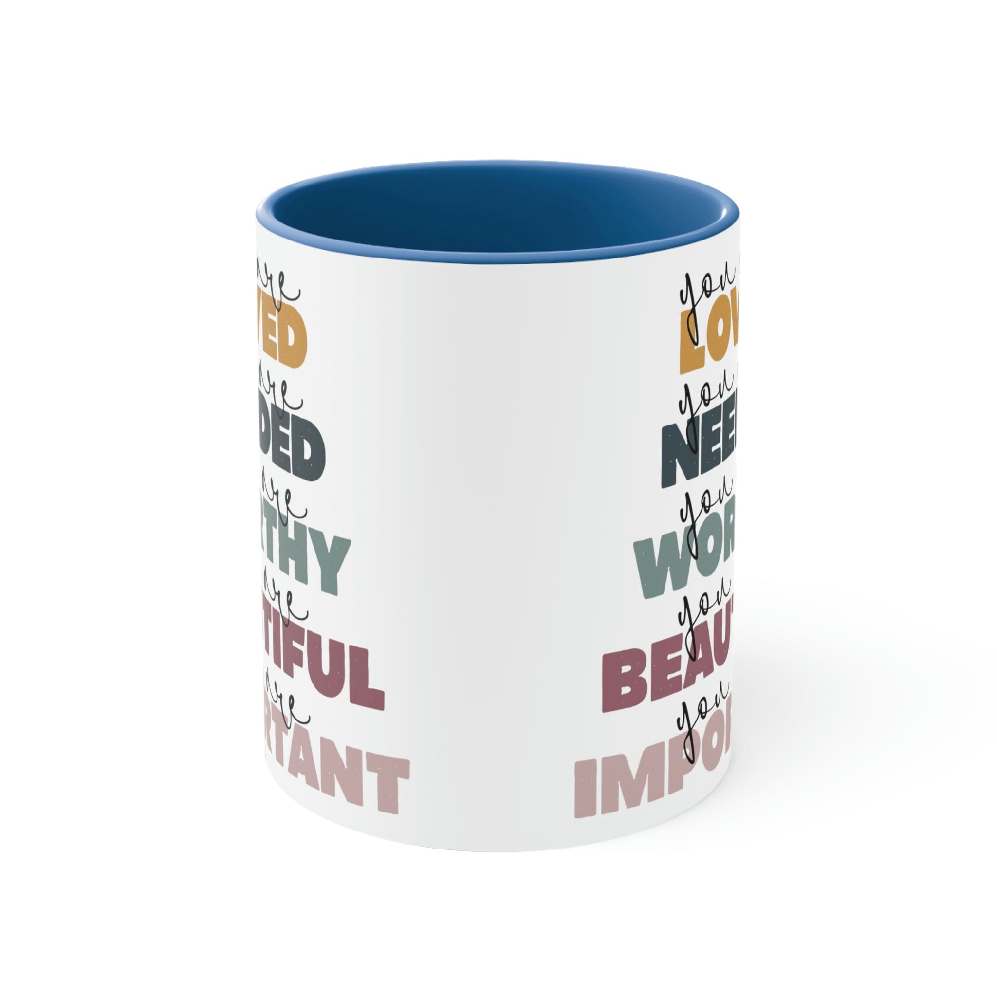 Two-tone ceramic mug with a white exterior and colored interior, featuring a C-handle and the phrase 'you are Loved'.