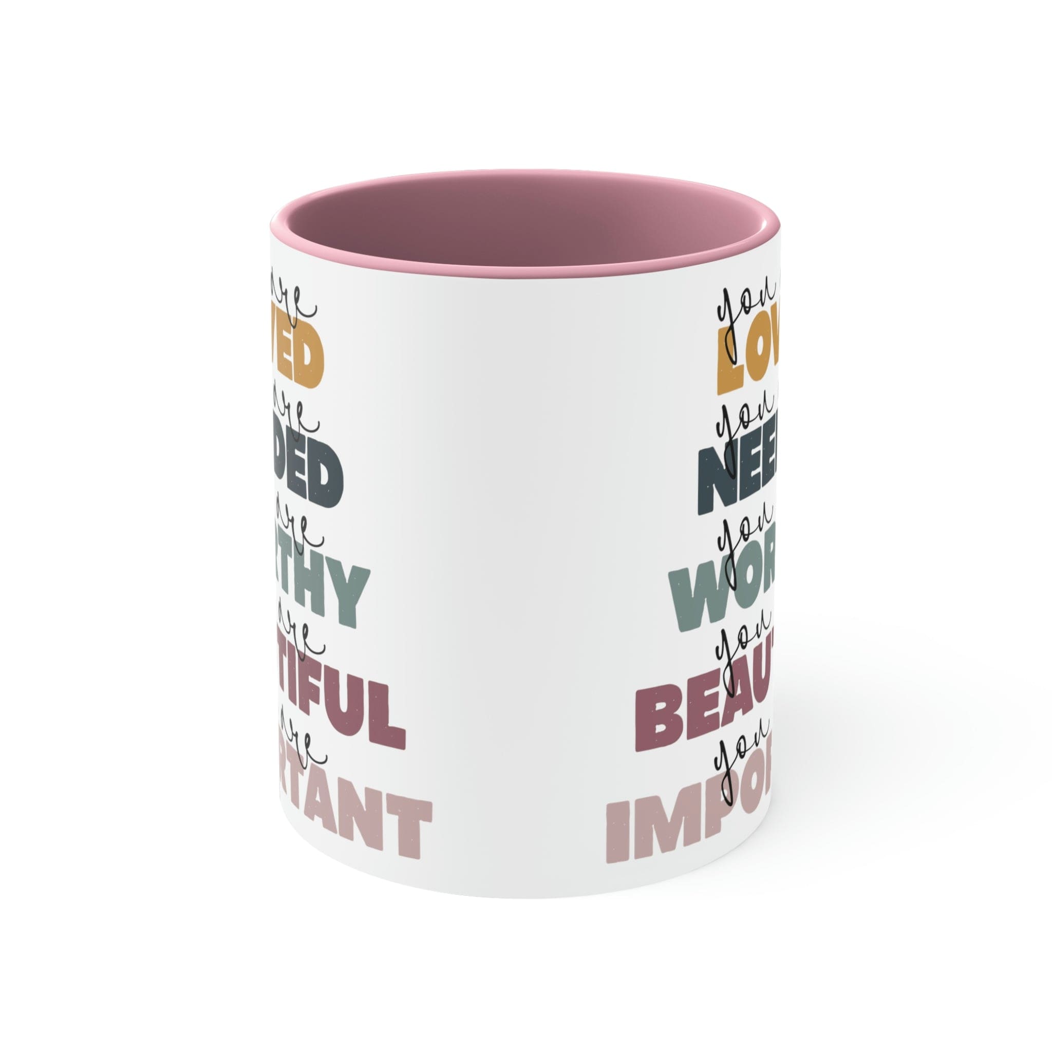 Two-tone ceramic mug with a white exterior and colored interior, featuring a C-handle and the phrase 'you are Loved'.