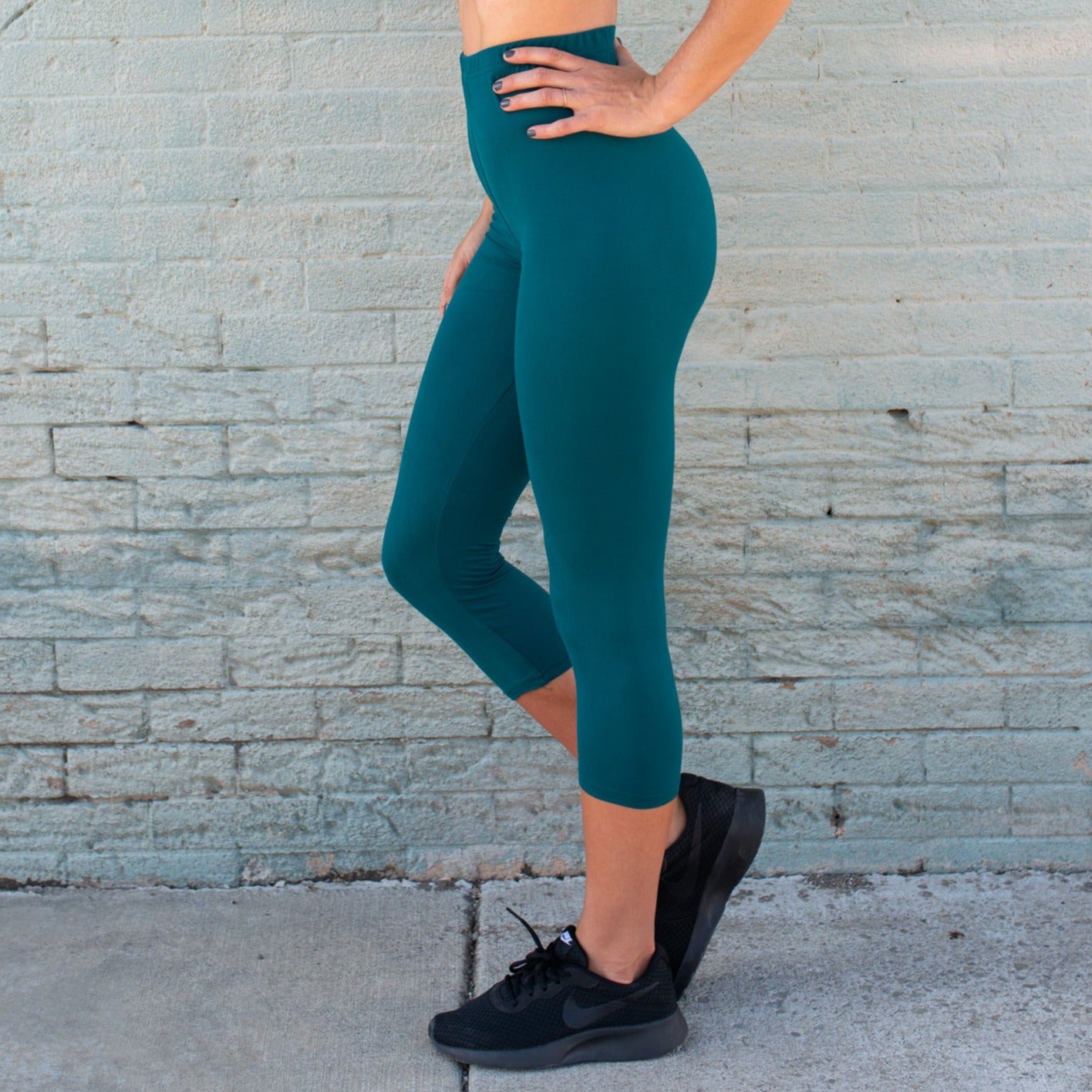 A pair of ultra soft capri leggings in a stylish design, showcasing their buttery texture and comfortable fit.