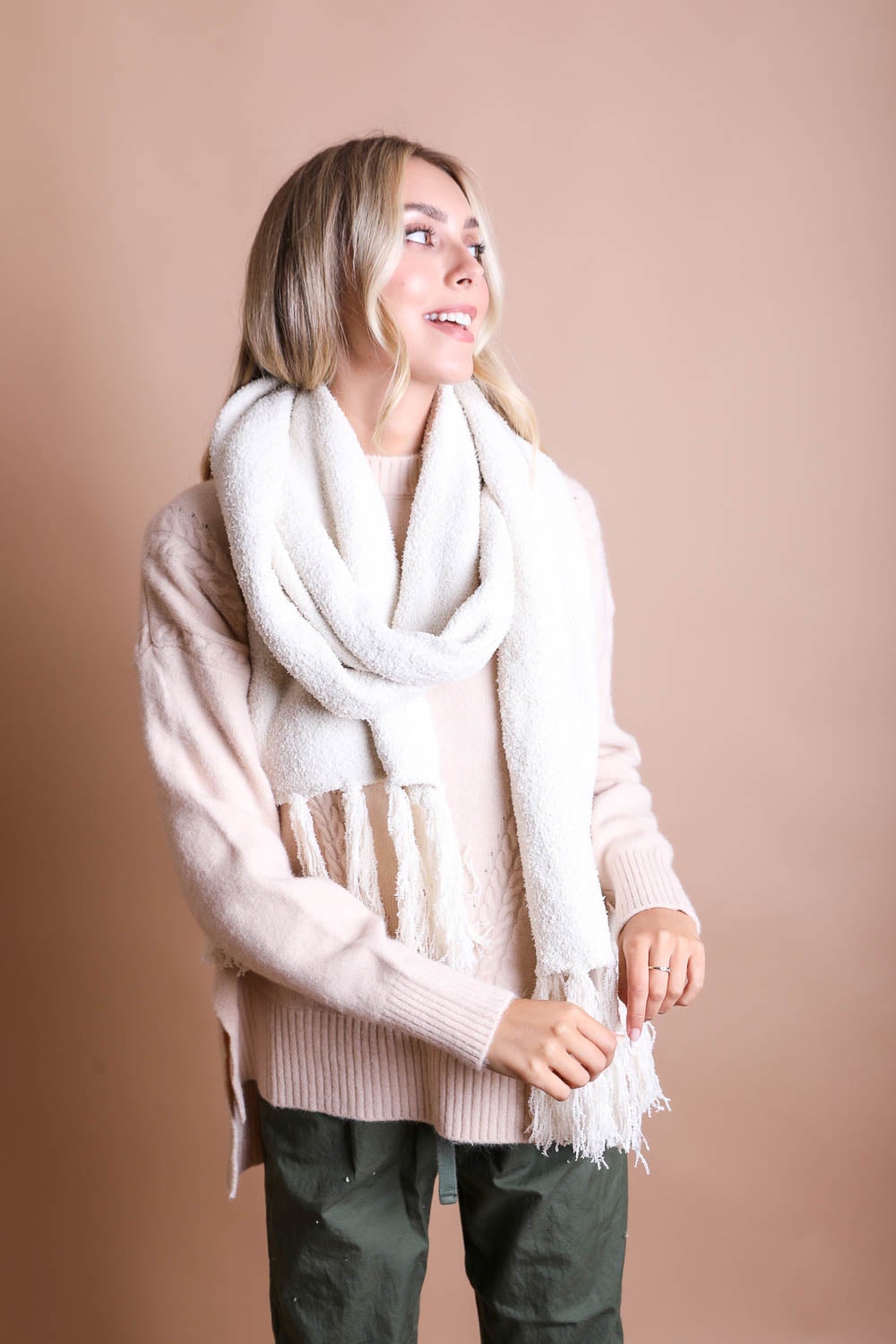 A cozy Ultra-Soft Boucle Tassel Scarf in a stylish design, featuring soft acrylic material and trendy tassels at both ends.