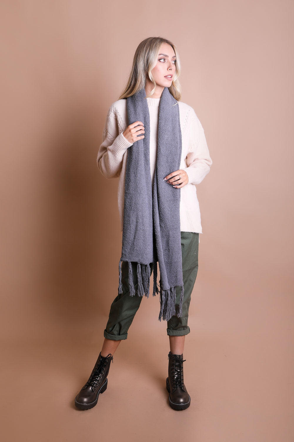 A cozy Ultra-Soft Boucle Tassel Scarf in a stylish design, featuring soft acrylic material and trendy tassels at both ends.