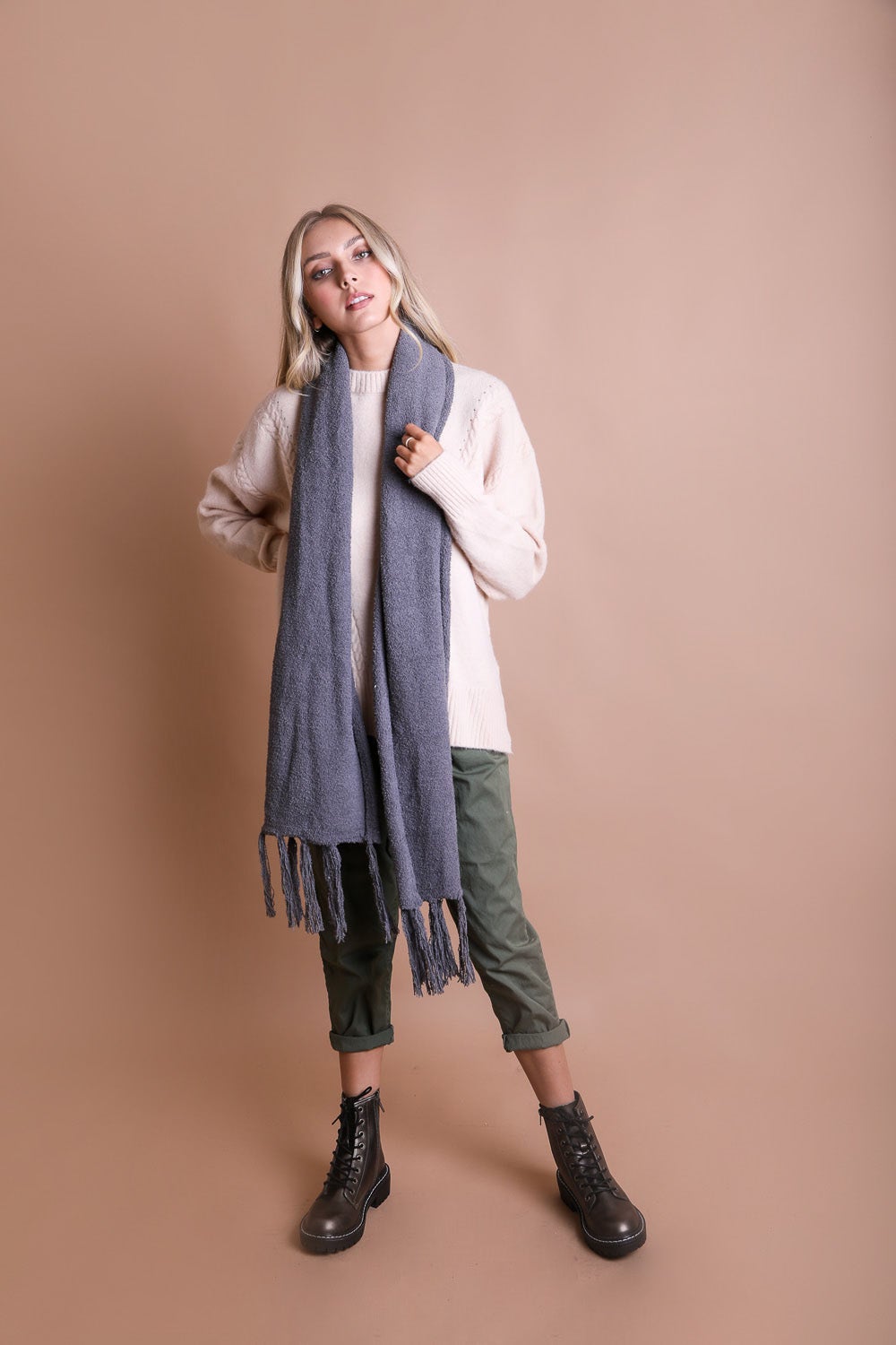 A cozy Ultra-Soft Boucle Tassel Scarf in a stylish design, featuring soft acrylic material and trendy tassels at both ends.