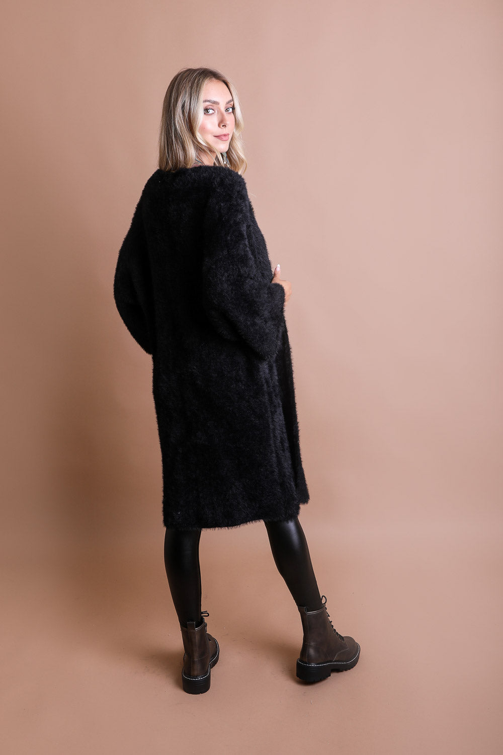 A cozy Ultra-Soft Luxe Mohair Knit Cardigan featuring dolman sleeves and a faux fur collar, perfect for winter wear.