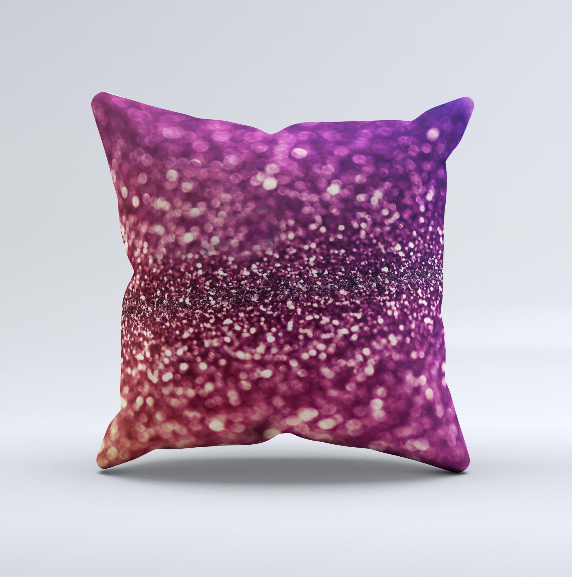 A beautifully handcrafted decorative throw pillow featuring unfocused purple and pink glimmer ink design, showcasing unique imperfections.