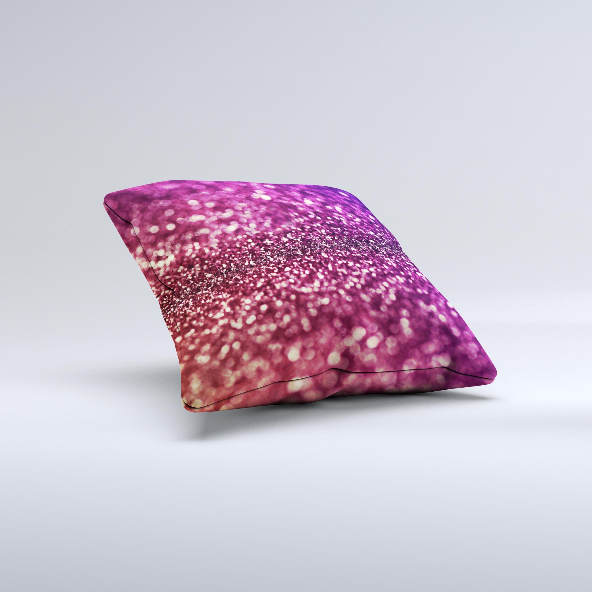 A beautifully handcrafted decorative throw pillow featuring unfocused purple and pink glimmer ink design, showcasing unique imperfections.