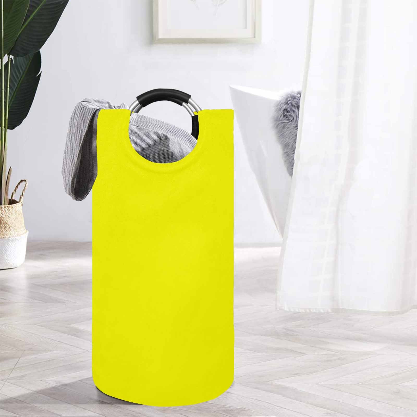 Uniquely You Yellow Round Laundry Bag made from waterproof fabric with sturdy handles.