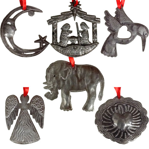 A collection of beautifully handcrafted upcycled metal ornaments from Haiti, showcasing unique designs like angels, elephants, and hearts.