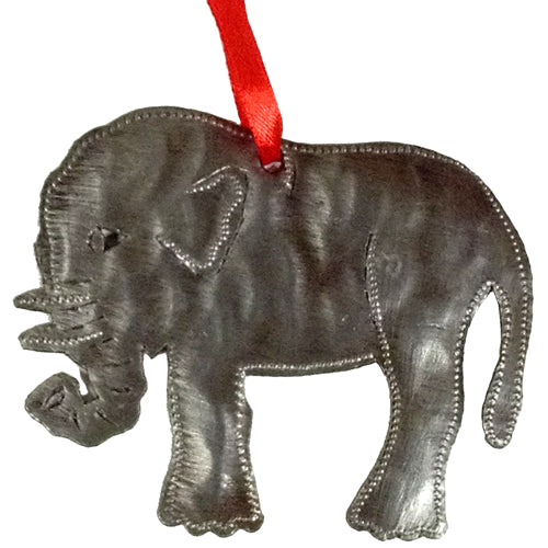 A collection of beautifully handcrafted upcycled metal ornaments from Haiti, showcasing unique designs like angels, elephants, and hearts.