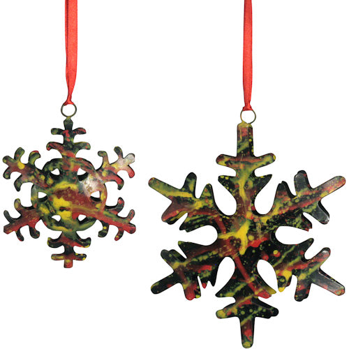 Upcycled Metal Snowflake Ornament, handmade with vibrant sponge-painted design in reds and yellows, showcasing unique artisan craftsmanship.