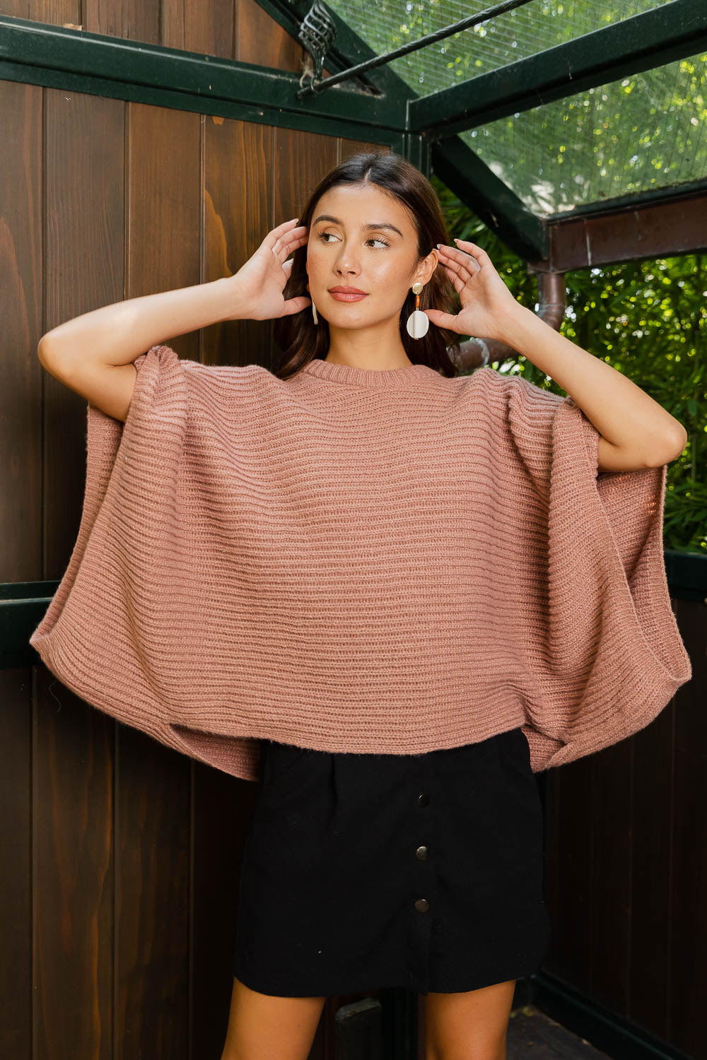 Urban Chic Ribbed Knit Sleeve Poncho featuring stylish ribbed sleeves and a flowing silhouette, perfect for urban fashion.