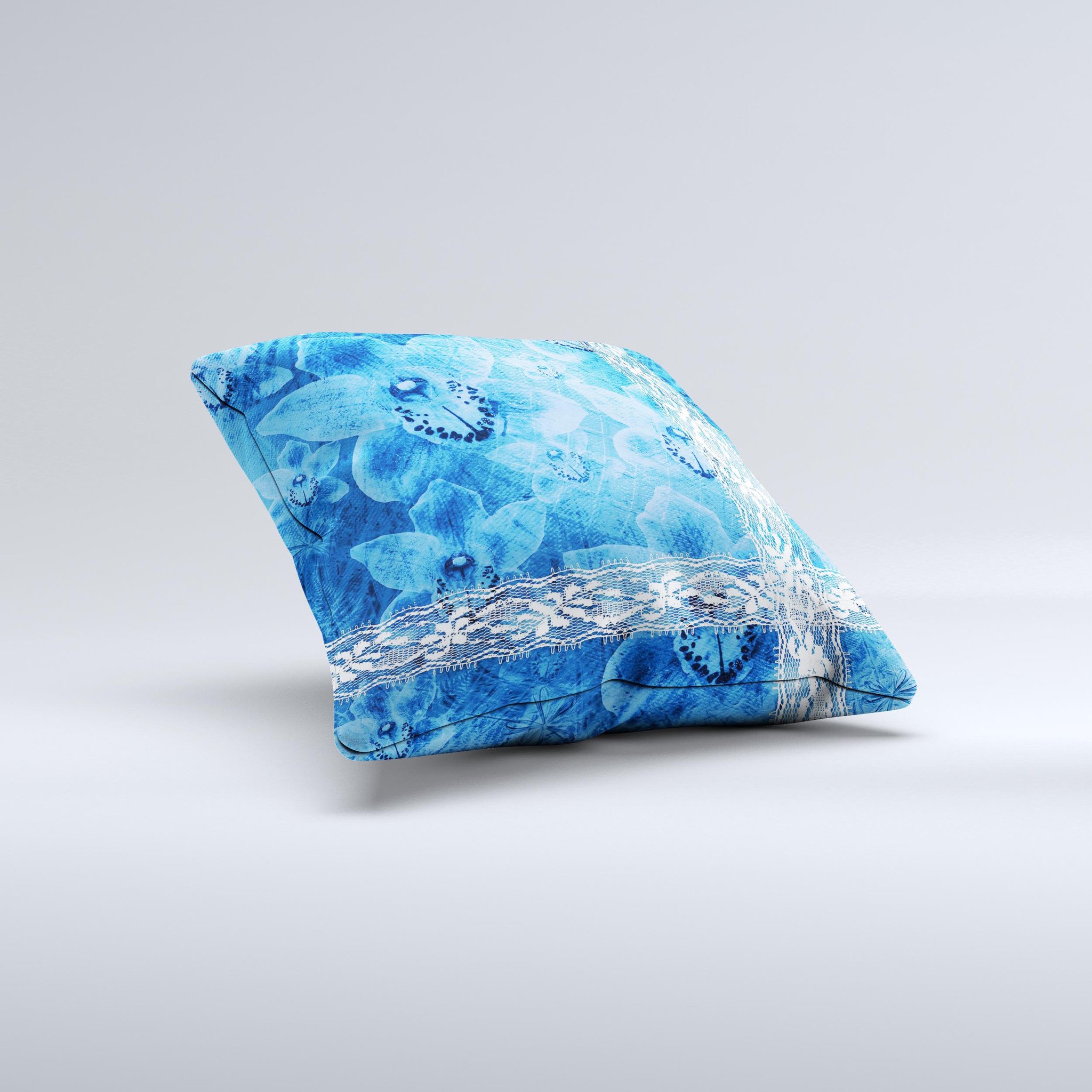 Vibrant blue and white floral lace decorative throw pillow, handcrafted with intricate designs and high-quality fabric.