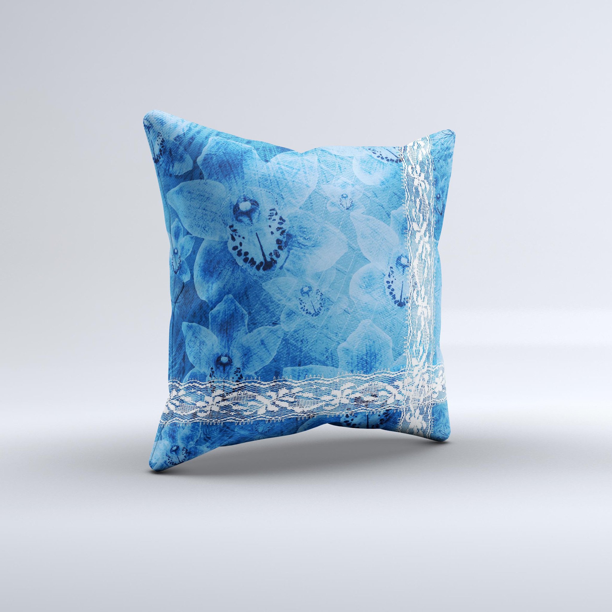 Vibrant blue and white floral lace decorative throw pillow, handcrafted with intricate designs and high-quality fabric.