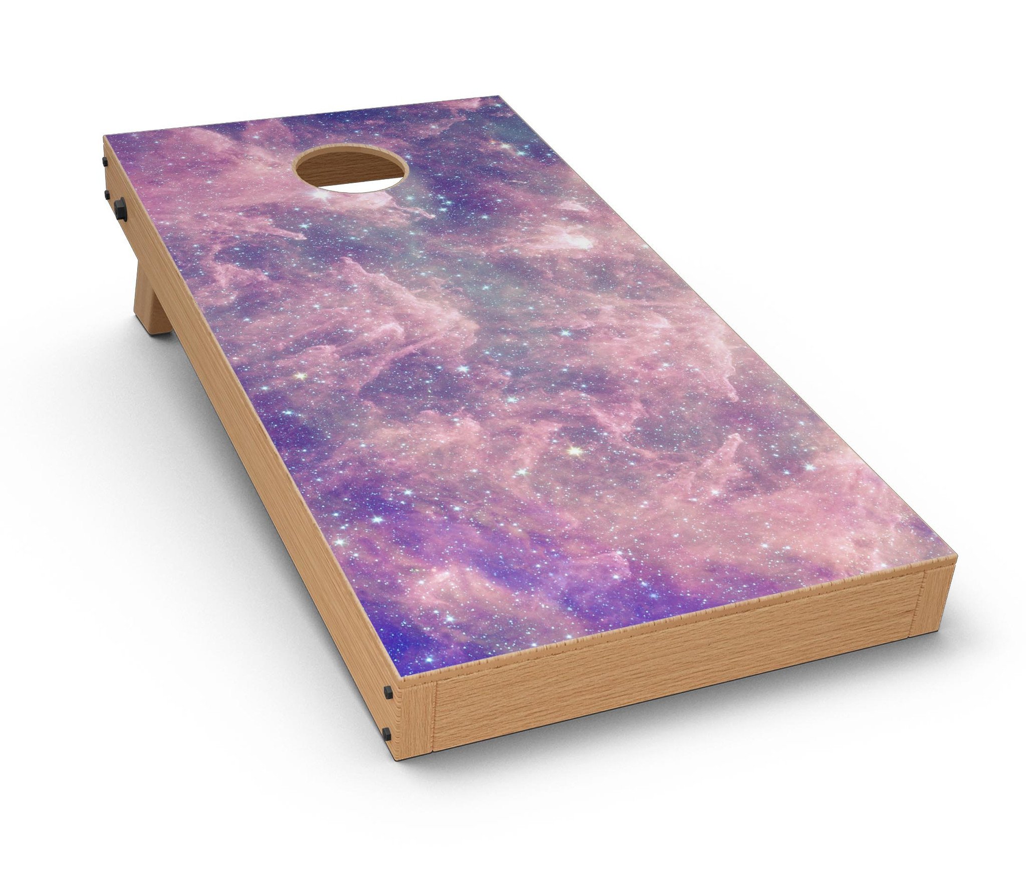 Vibrant sparkly pink nebula Cornhole board skin decal kit displayed on a wooden surface, showcasing its colorful design.