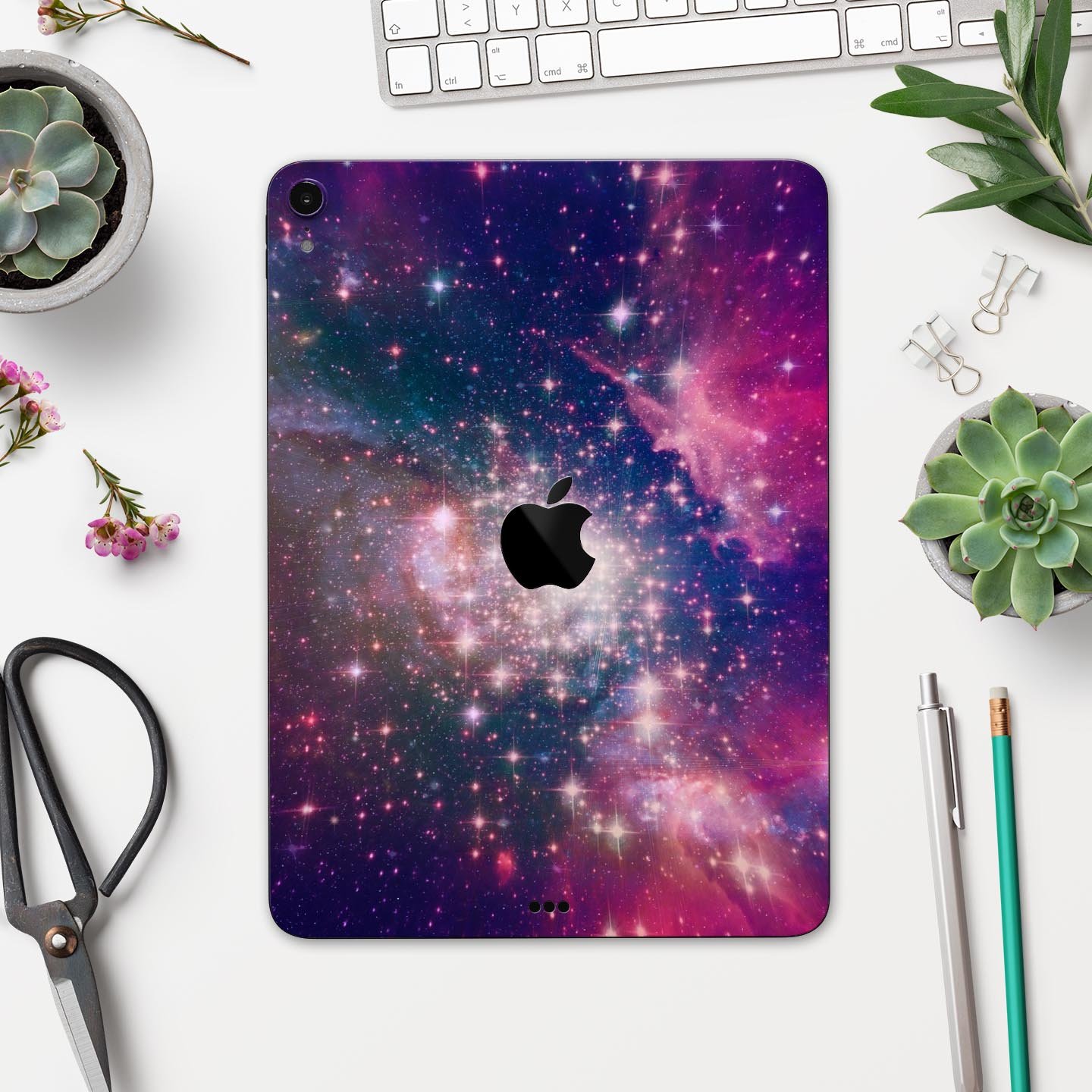 Vibrant Sparkly Pink Space skin decal for Apple iPad, showcasing a colorful and glossy design with a protective layer.