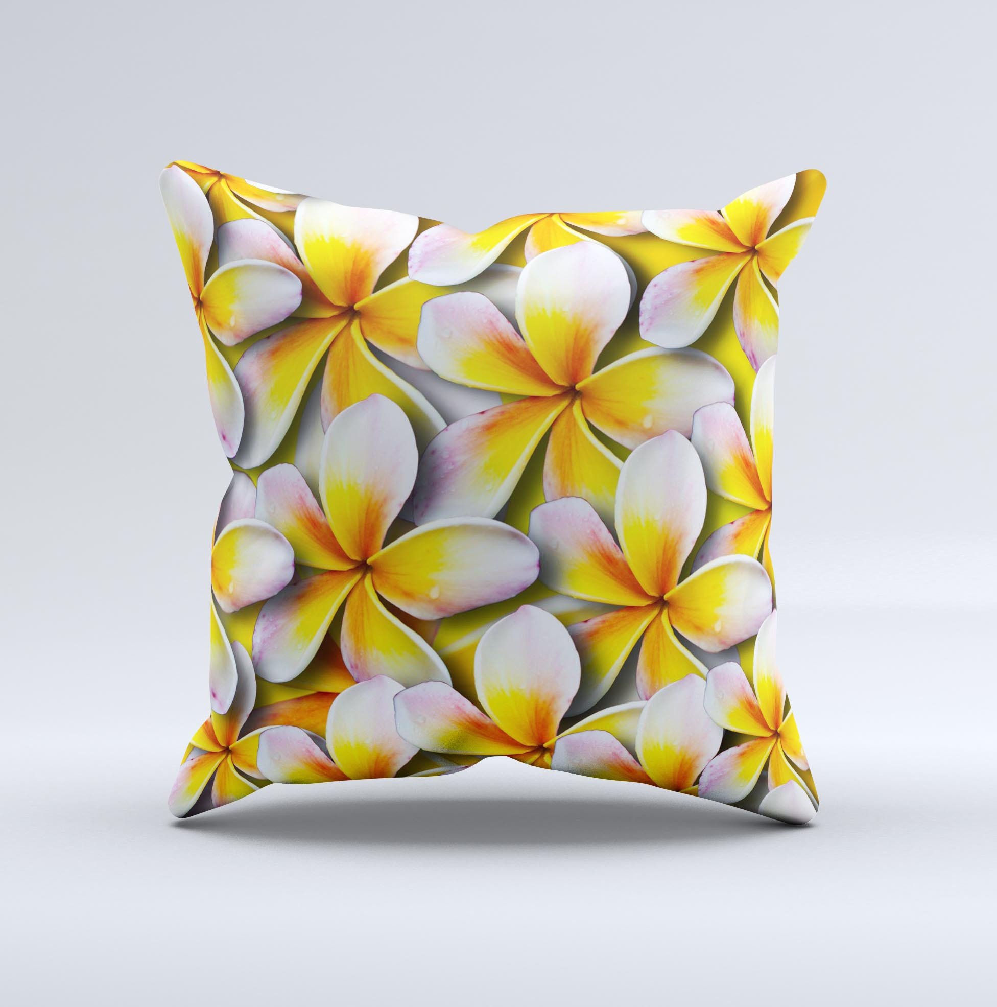 A vibrant yellow decorative throw pillow featuring a floral pattern, handcrafted in Virginia with high-quality materials.