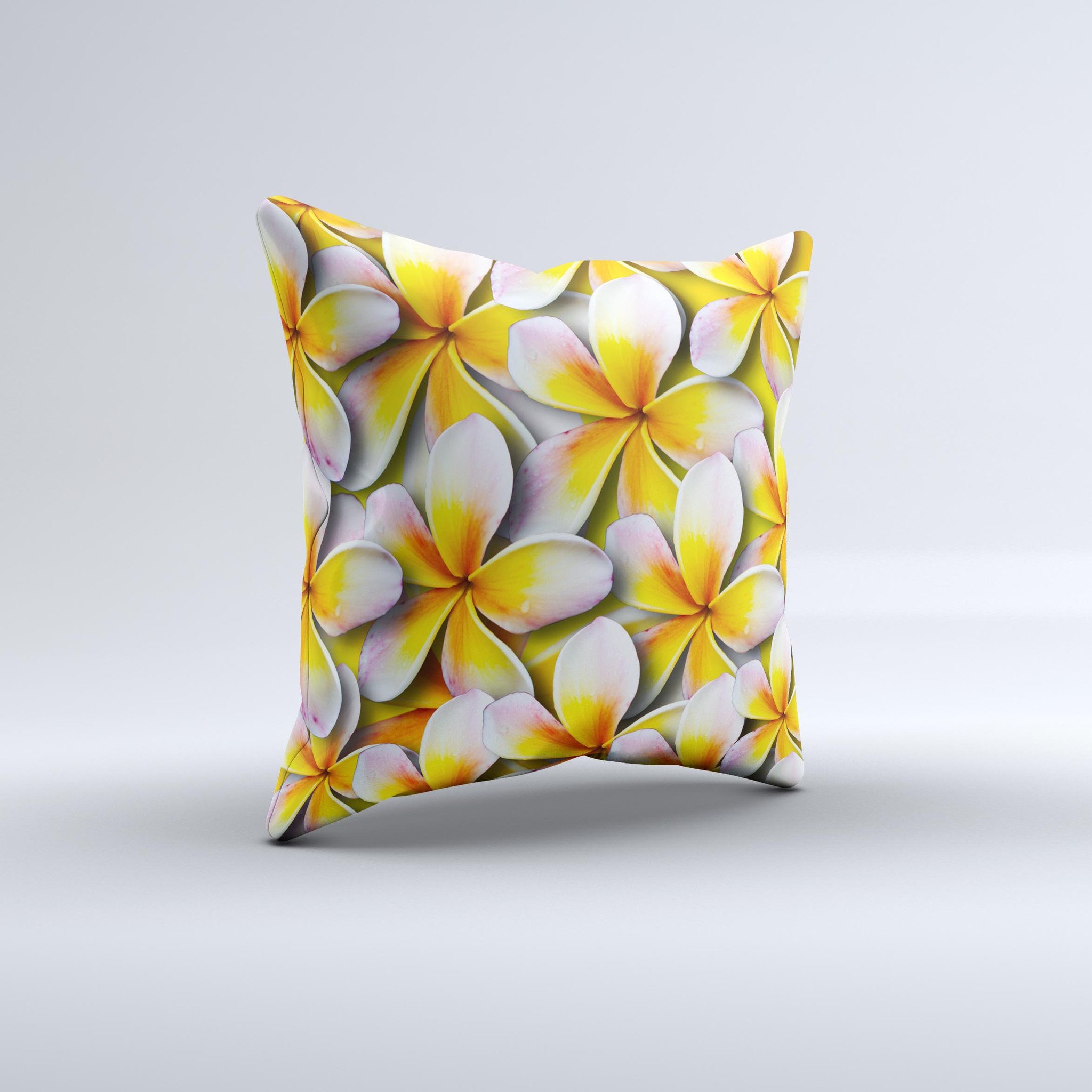 A vibrant yellow decorative throw pillow featuring a floral pattern, handcrafted in Virginia with high-quality materials.