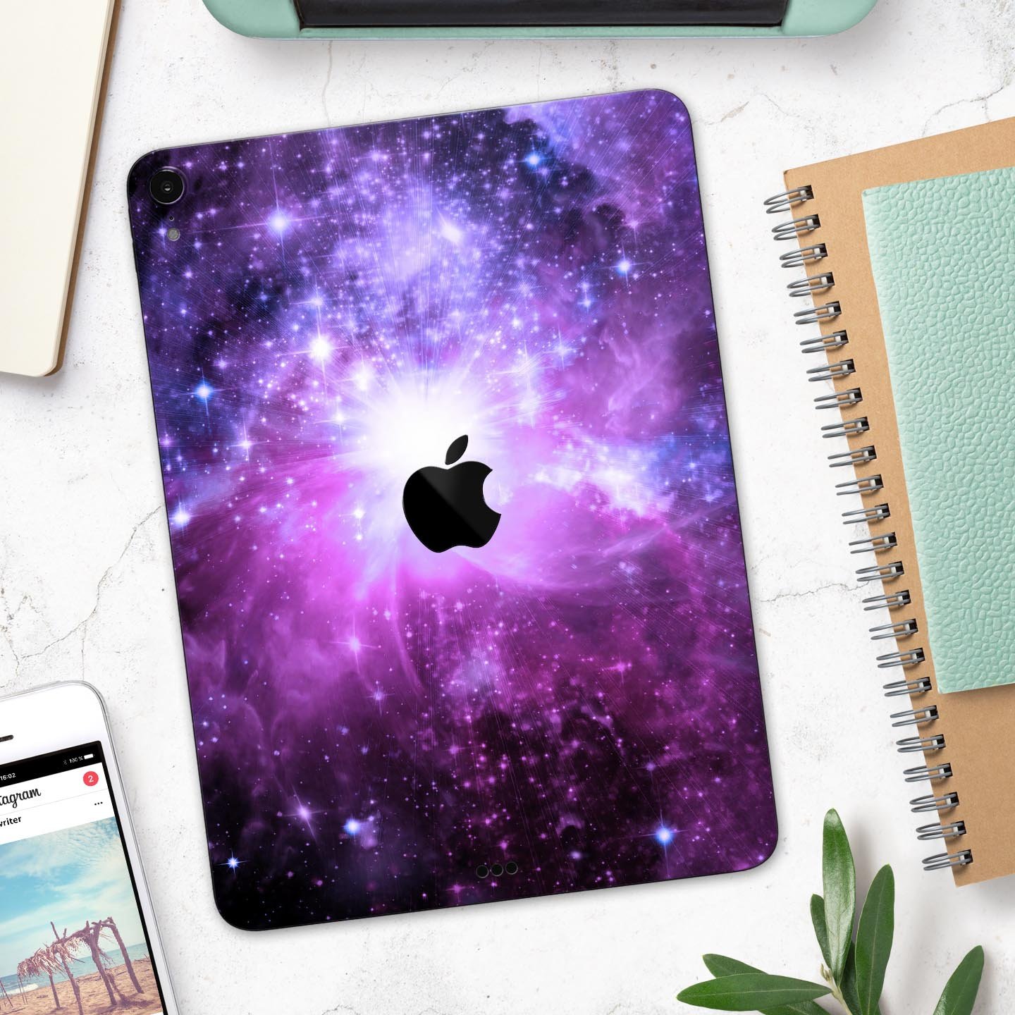 Violet Glowing Nebula skin decal for Apple iPad Pro, showcasing vibrant colors and a cosmic design.