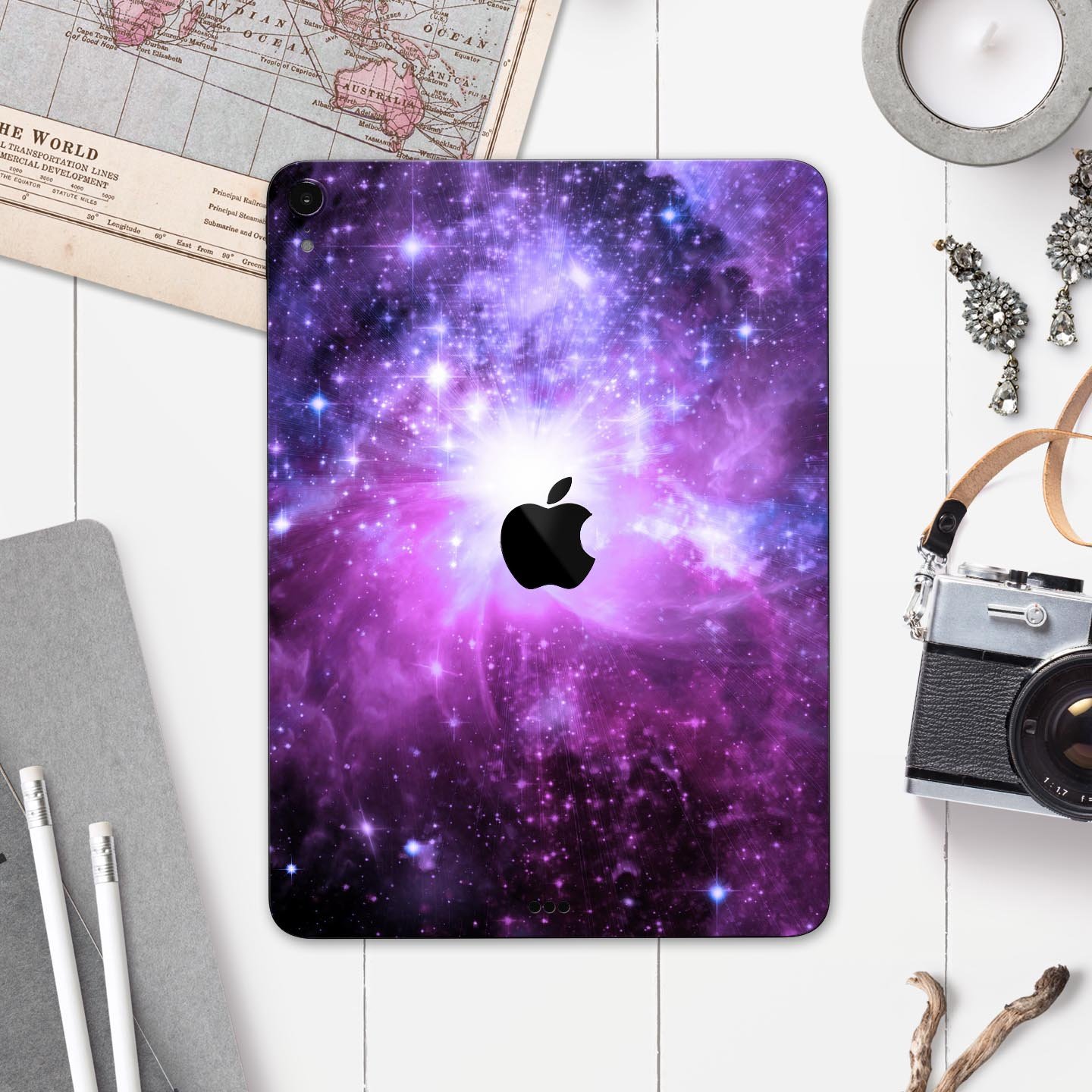 Violet Glowing Nebula skin decal for Apple iPad Pro, showcasing vibrant colors and a cosmic design.